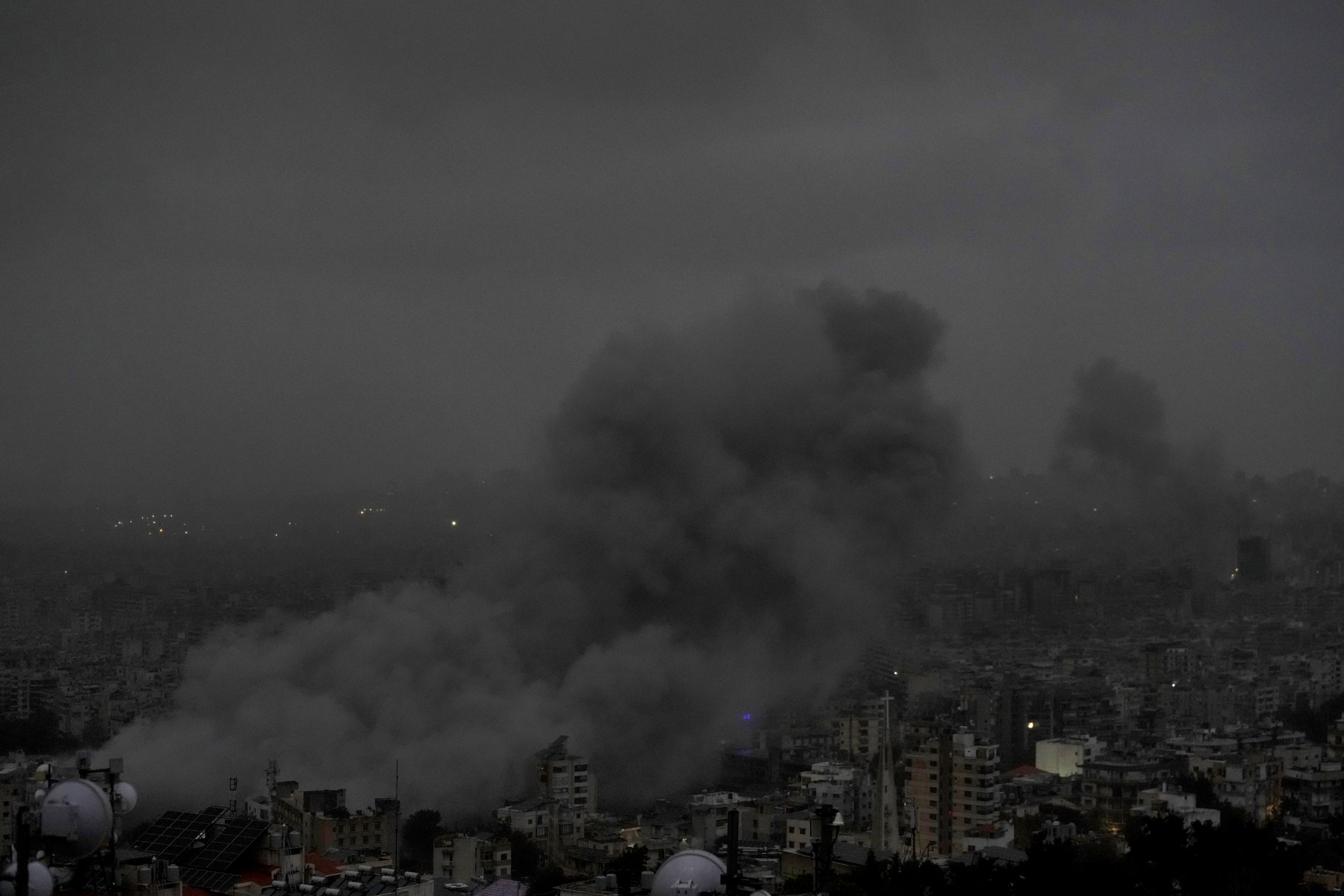 Smoke rises after an Israeli airstrike on Dahiyeh, in Beirut, Lebanon, Monday, Nov. 25, 2024. (AP Photo/Bilal Hussein)