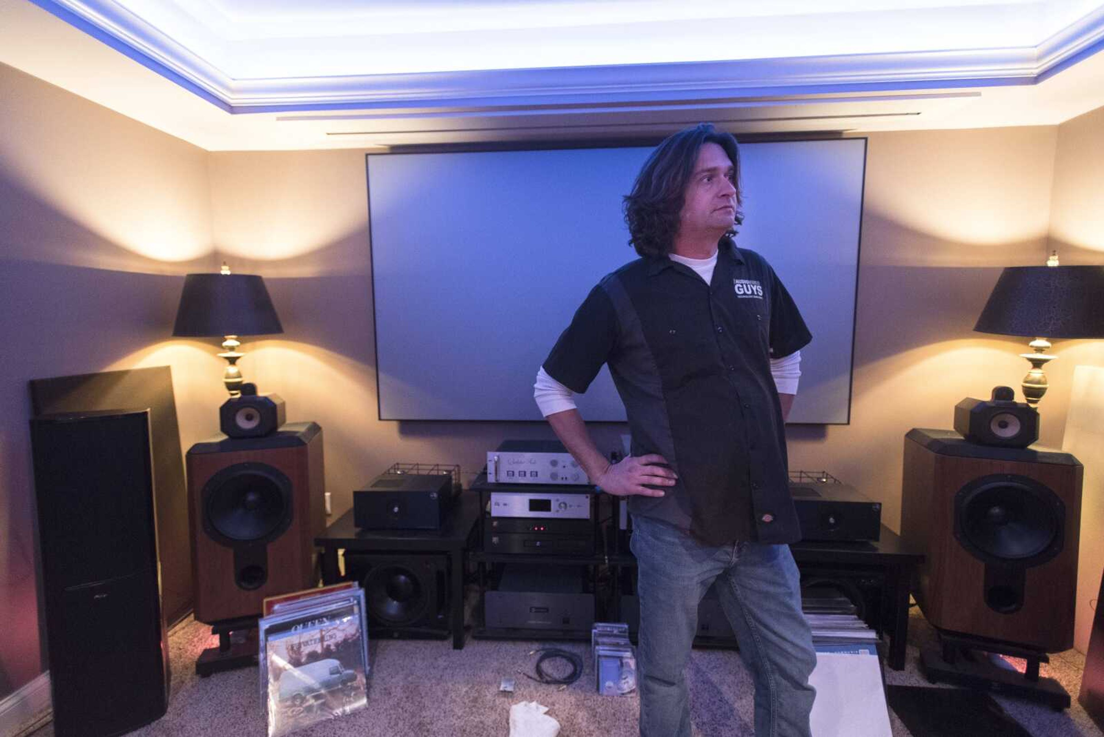 Brett Smith, owner of The Audio Video Guys, shows off his personal audio collection at his home Thursday in Jackson.