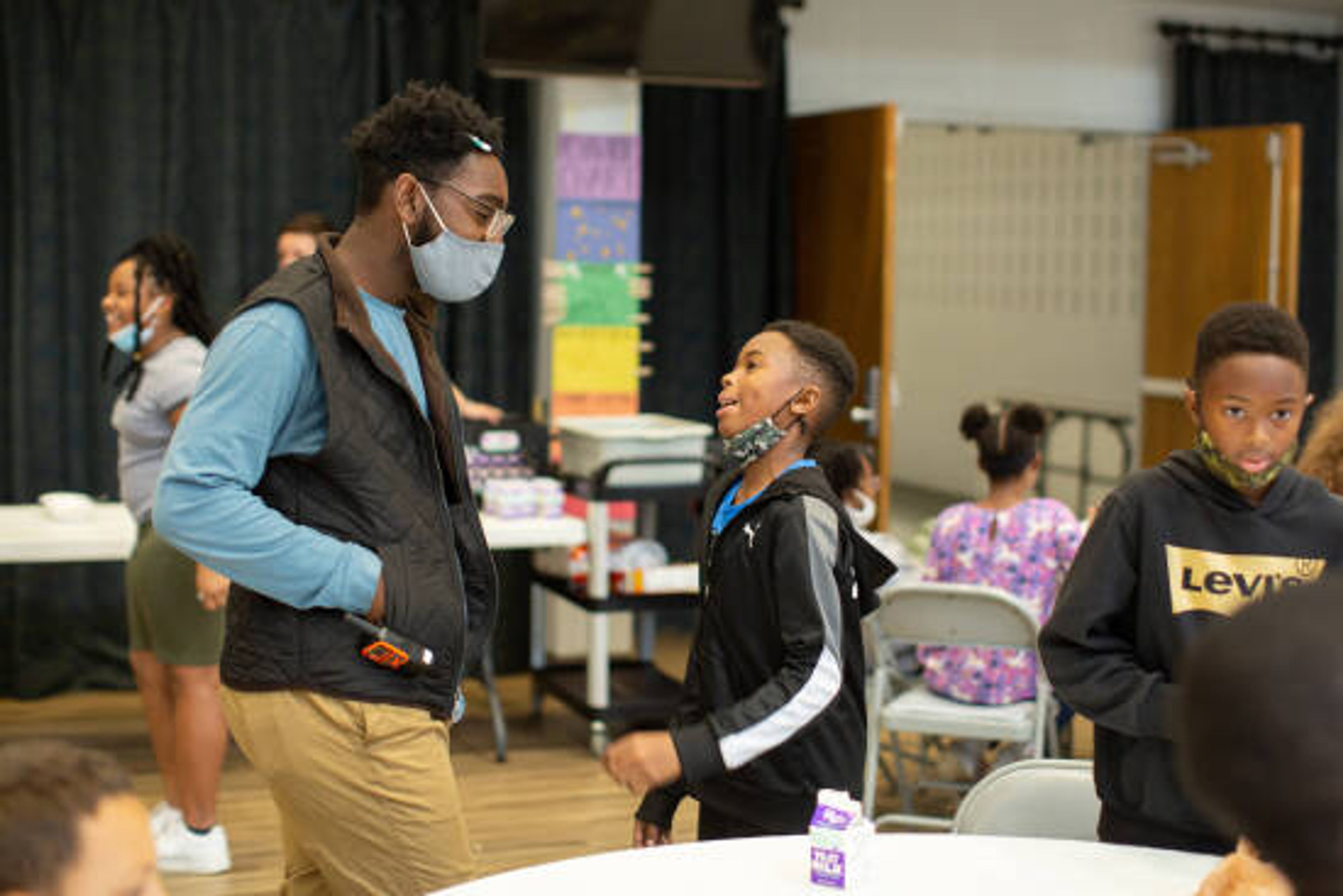 A worker with the Boys and Girls Clubs of Southeast Missouri talks with a student in October 2021.