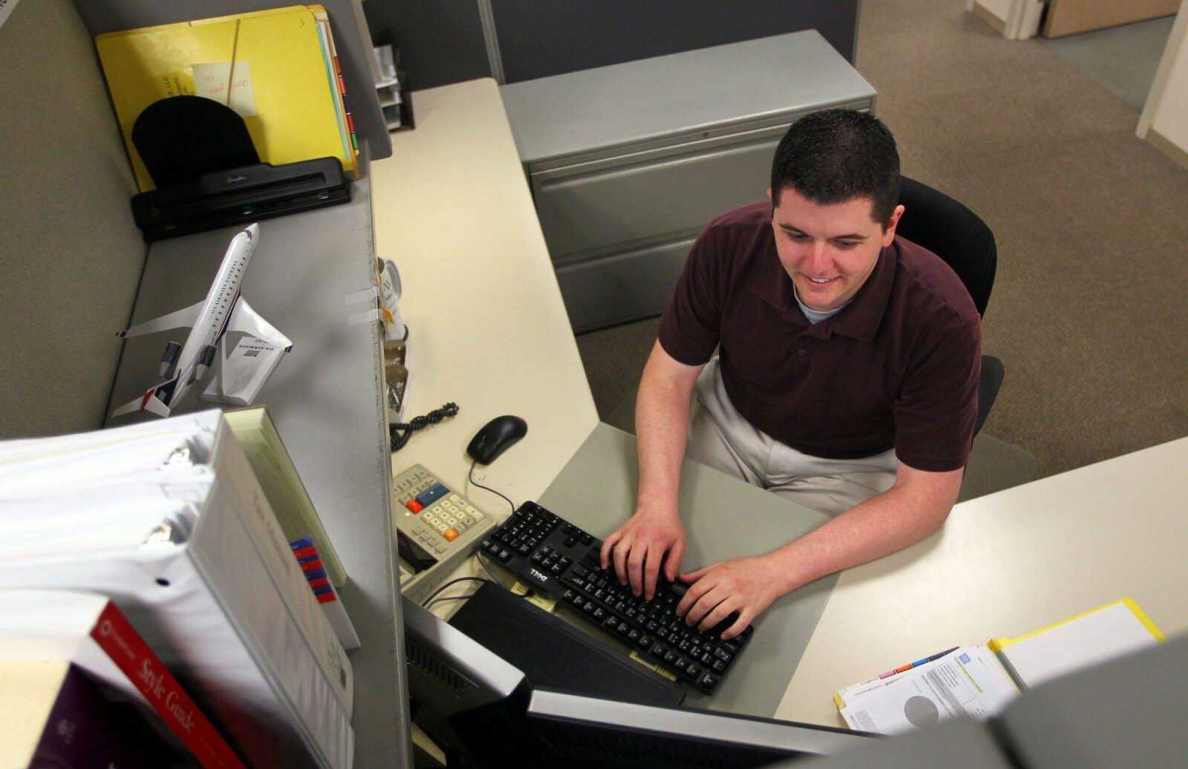 Dave Finklang, who was diagnosed with testicular cancer at 27, works at his desk in St. Louis. (Emily M. Rasinski ~ Post-Dispatch)