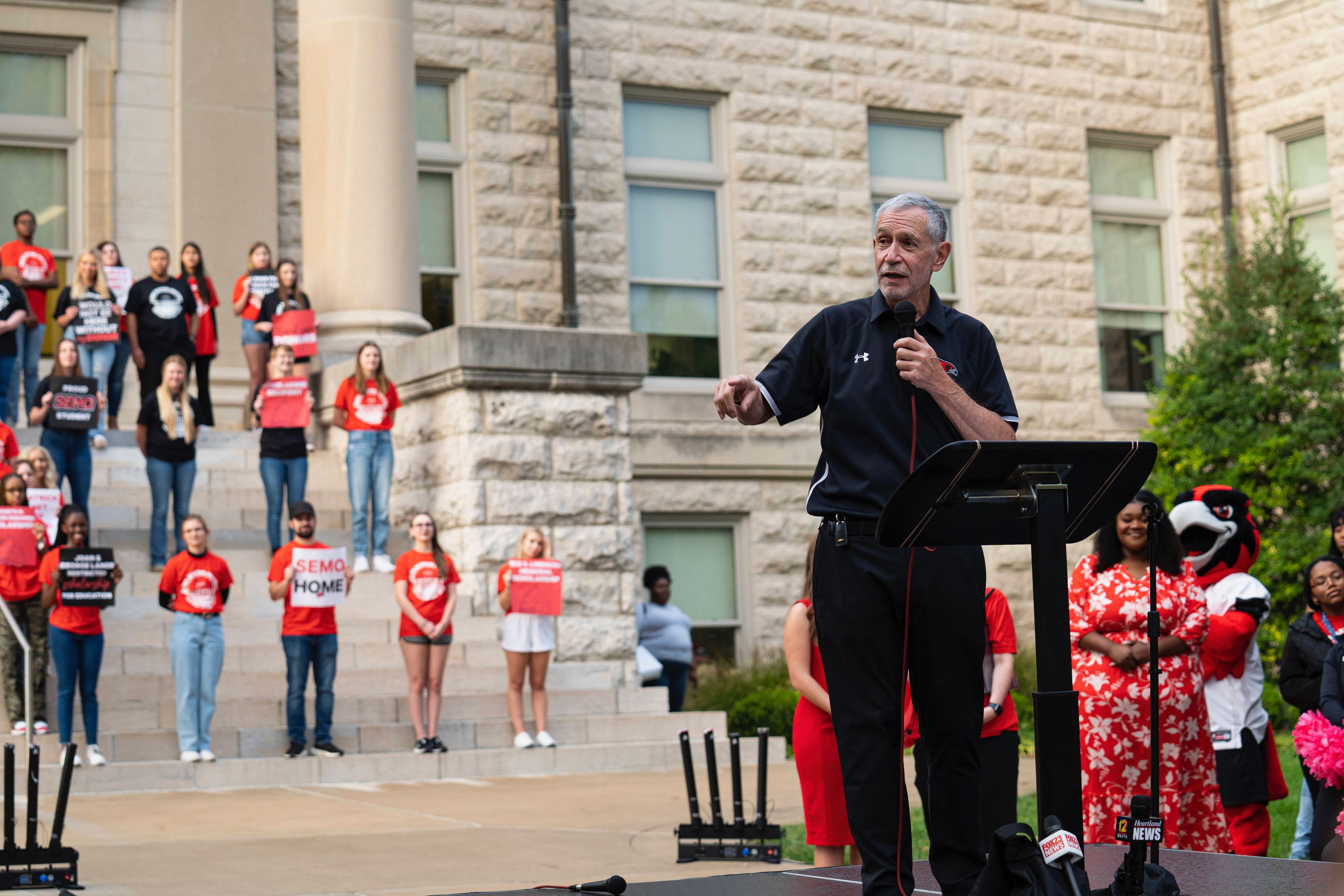 Dr. Carlos Vargas makes an announcement to SEMO students in front of Academic Hall.