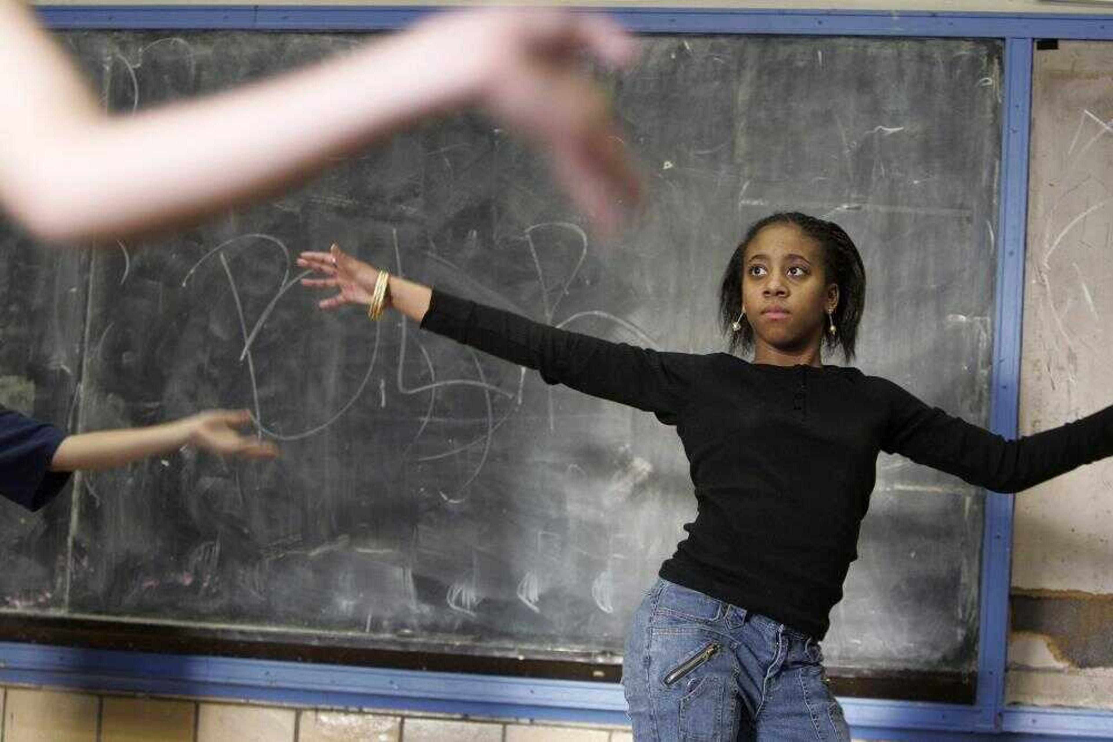 Taniqua Furtick, 14, participated in a Latin dance class recently as part of the extended school day at Edwards Middle School in the Charlestown neighborhood of Boston. (MICHAEL DWYER ~ Associated Press)