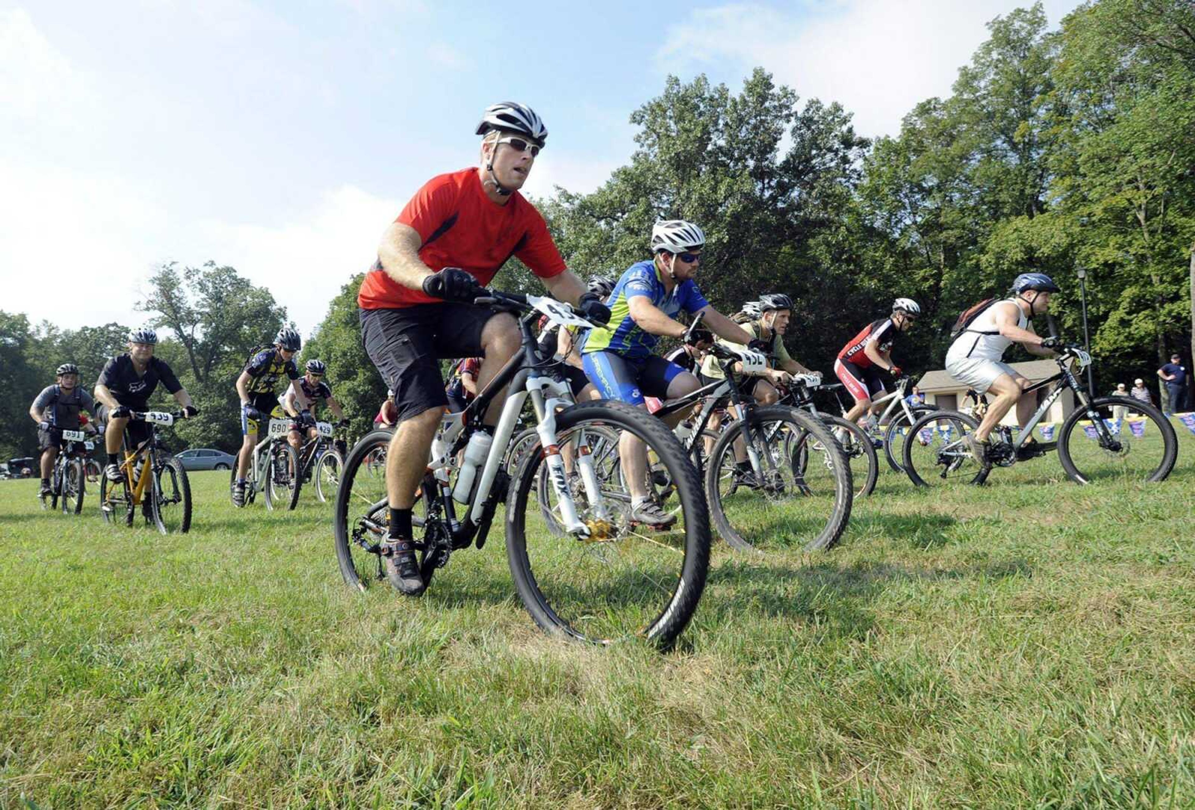 Josh Goza, center, and David Thompson begin their race with the pack in the Cyclewerx Crankfest 2011 on Sunday at Klaus Park. (Fred Lynch)