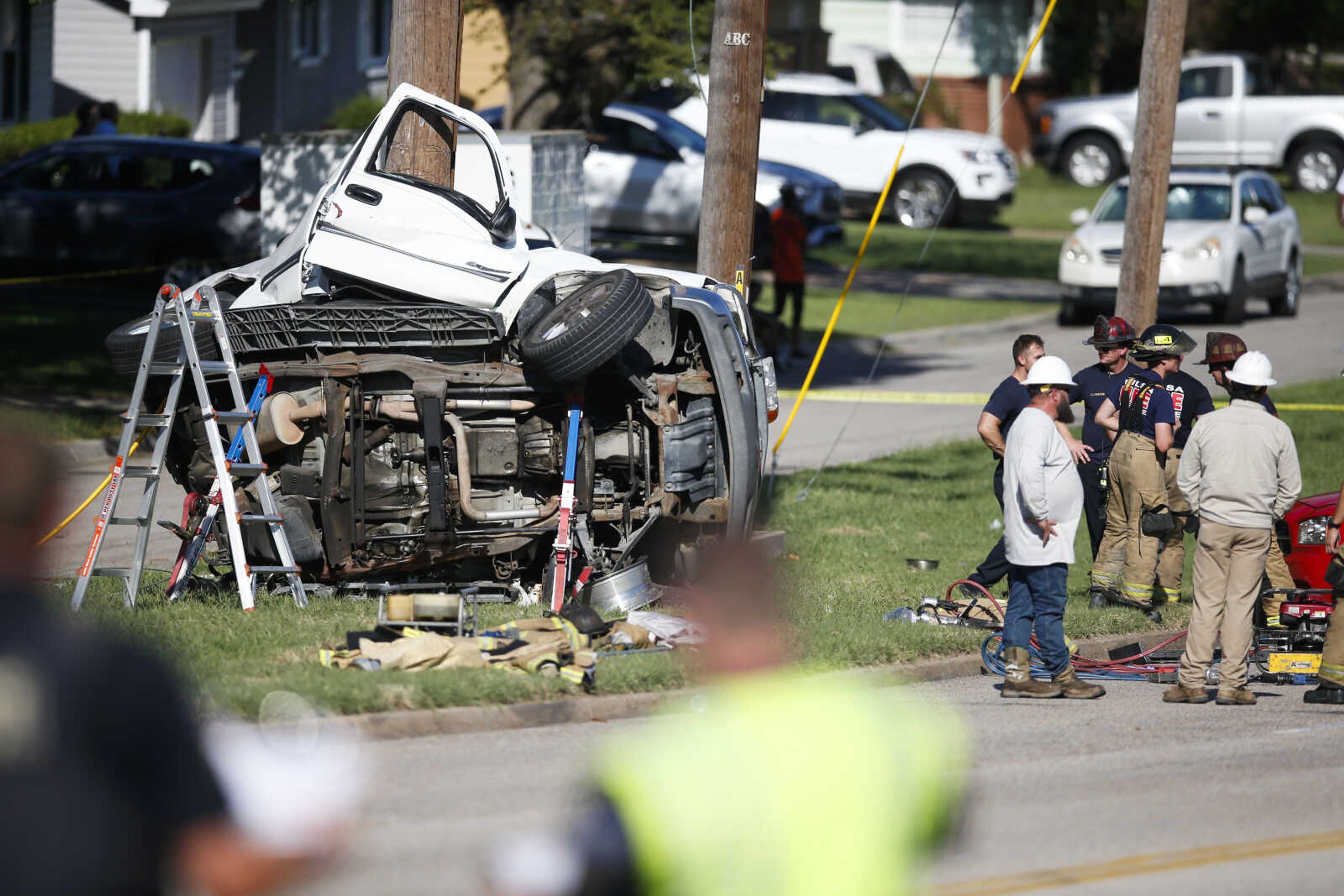 FILE - Emergency workers work the scene of a fatal accident on Aug. 24, 2021 in Tulsa, Okla. Nearly 43,000 people died in U.S. traffic crashes in 2021, with deaths due to speeding and impaired or distracted driving on the rise. The 2021 final numbers, released Monday, April 3, 2023 by the National Highway Traffic Safety Administration, confirmed earlier estimates showing a 10.5% increase in deaths over 2020. (Michael Noble Jr./Tulsa World via AP, File)