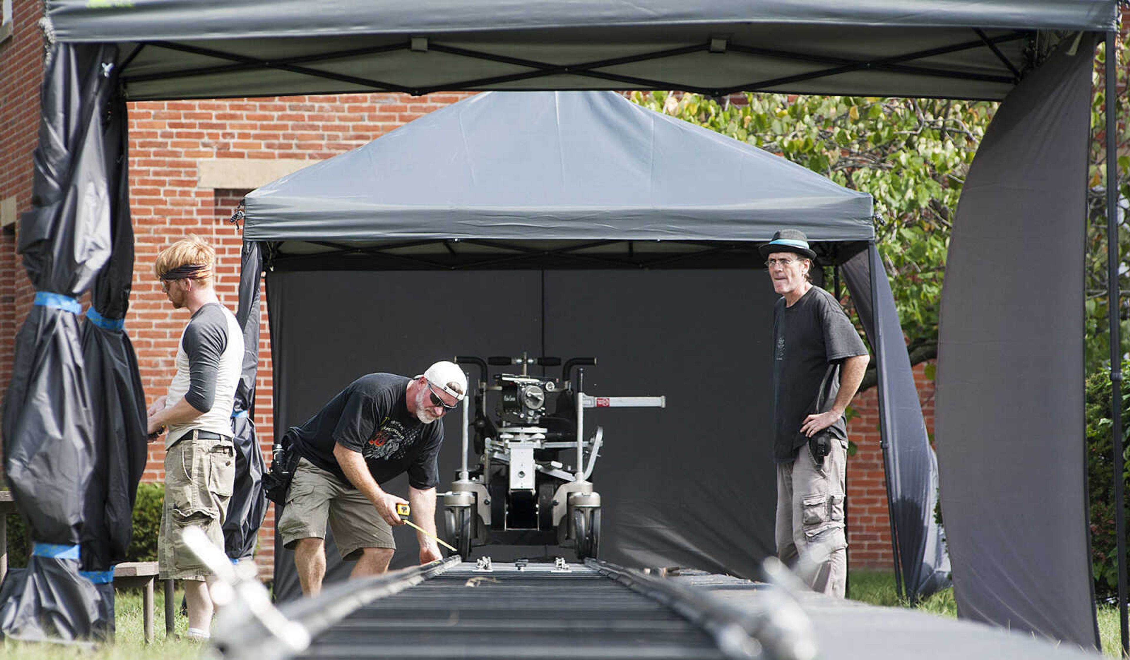 ADAM VOGLER ~ avogler@semissourian.com
Crew members for the 20th Century Fox feature film "Gone Girl," prepare a dolly prior to filming a scene at the Common Pleas Courthouse Thursday, Oct. 3, in downtown Cape Girardeau.