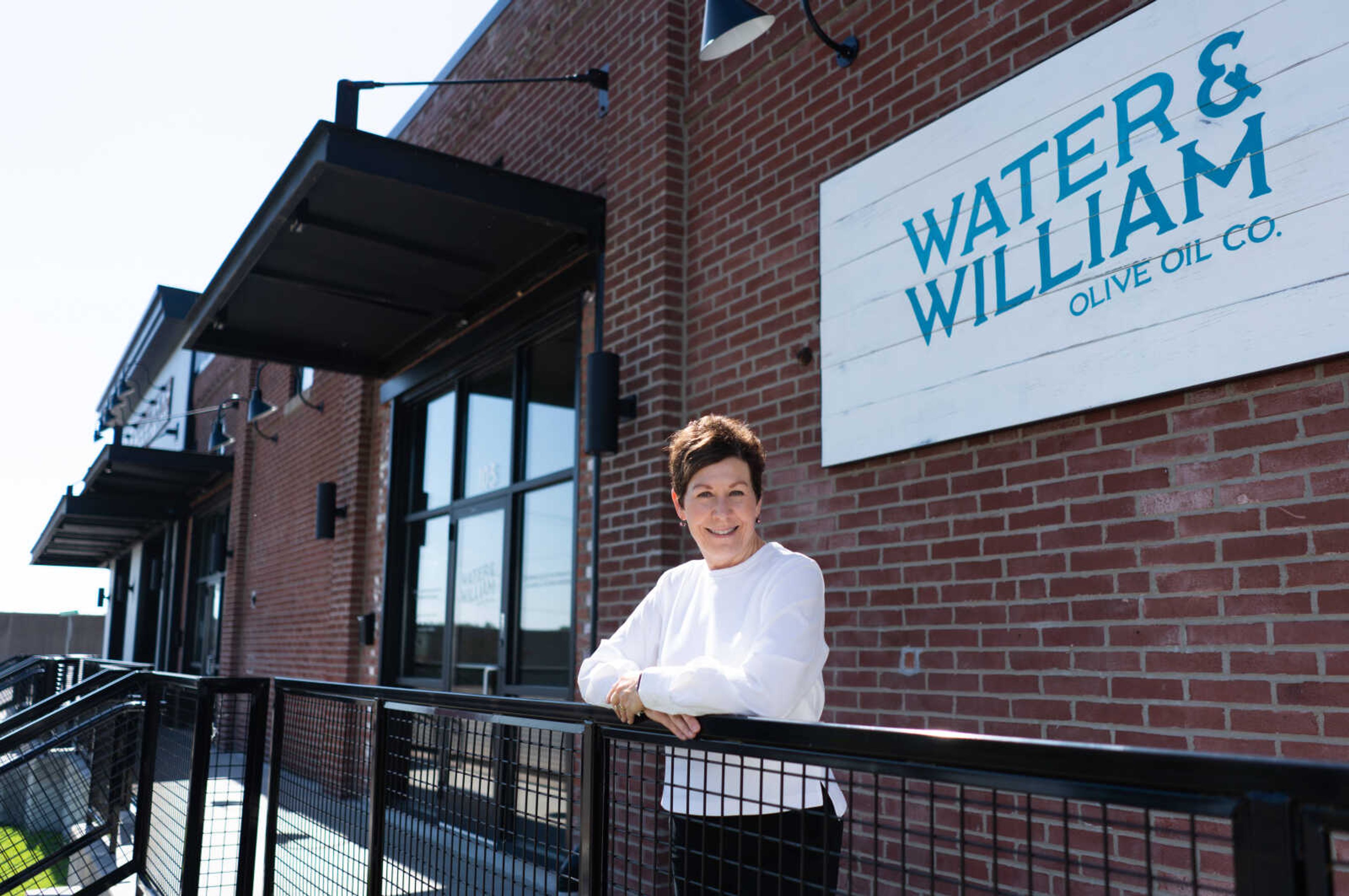 Georgia Lowman, co-owner of Water and William Olive Oil Co., stands in front of her shop at 105 William St. in downtown Cape Girardeau. Georgia and her husband Todd Lowman have been small business owners for 30 years.