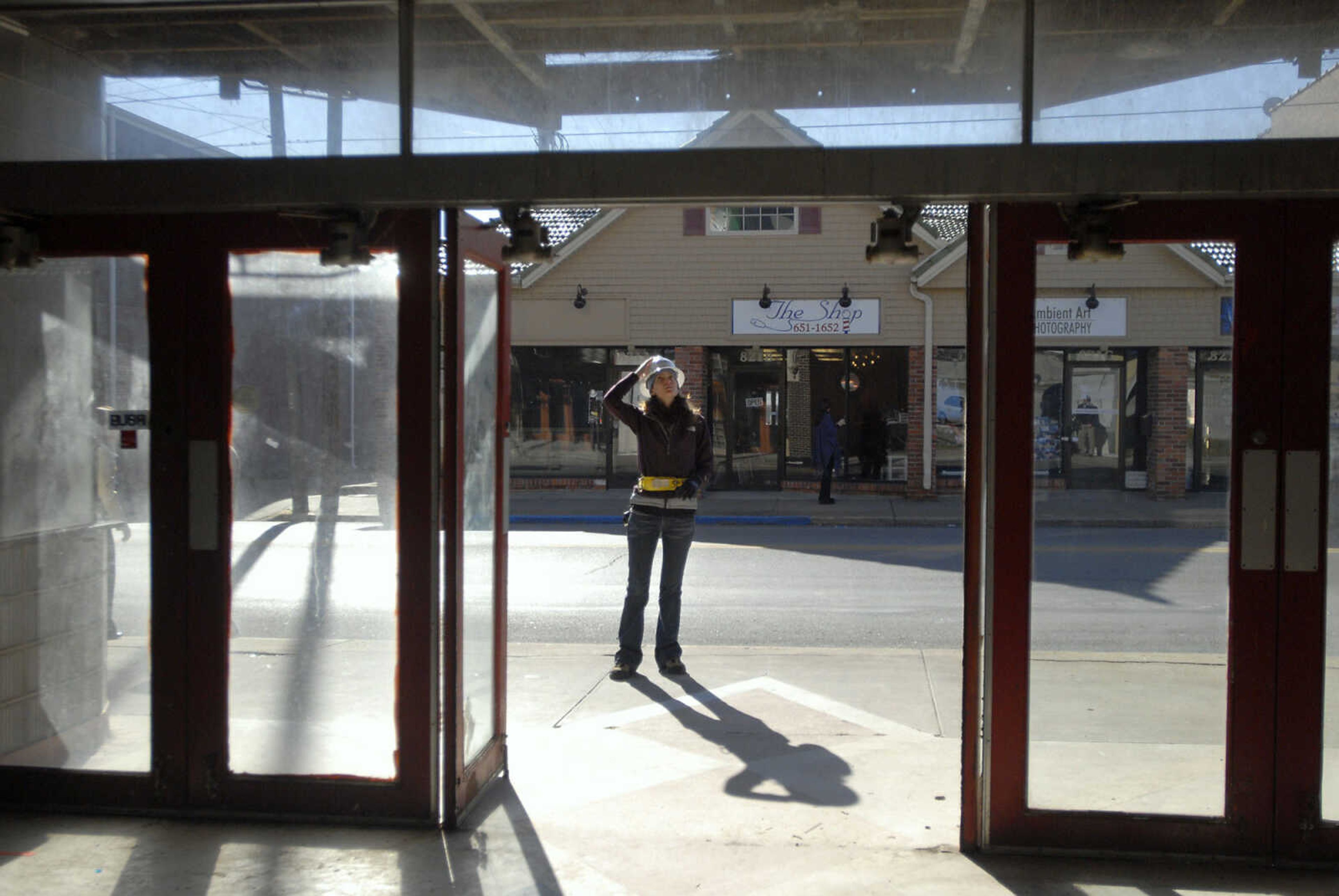 KRISTIN EBERTS ~ keberts@semissourian.com

Farrah Katzer, of Kiku Obata & Company, works to take measurements of the front facade of the Esquire Theater building on Friday, Jan. 6, 2012, in Cape Girardeau. Renovation work on the Esquire Theater continues as workers from Kiku Obata & Company and Penzel Construction complete field verification work and take measurements necessary for the design plans.