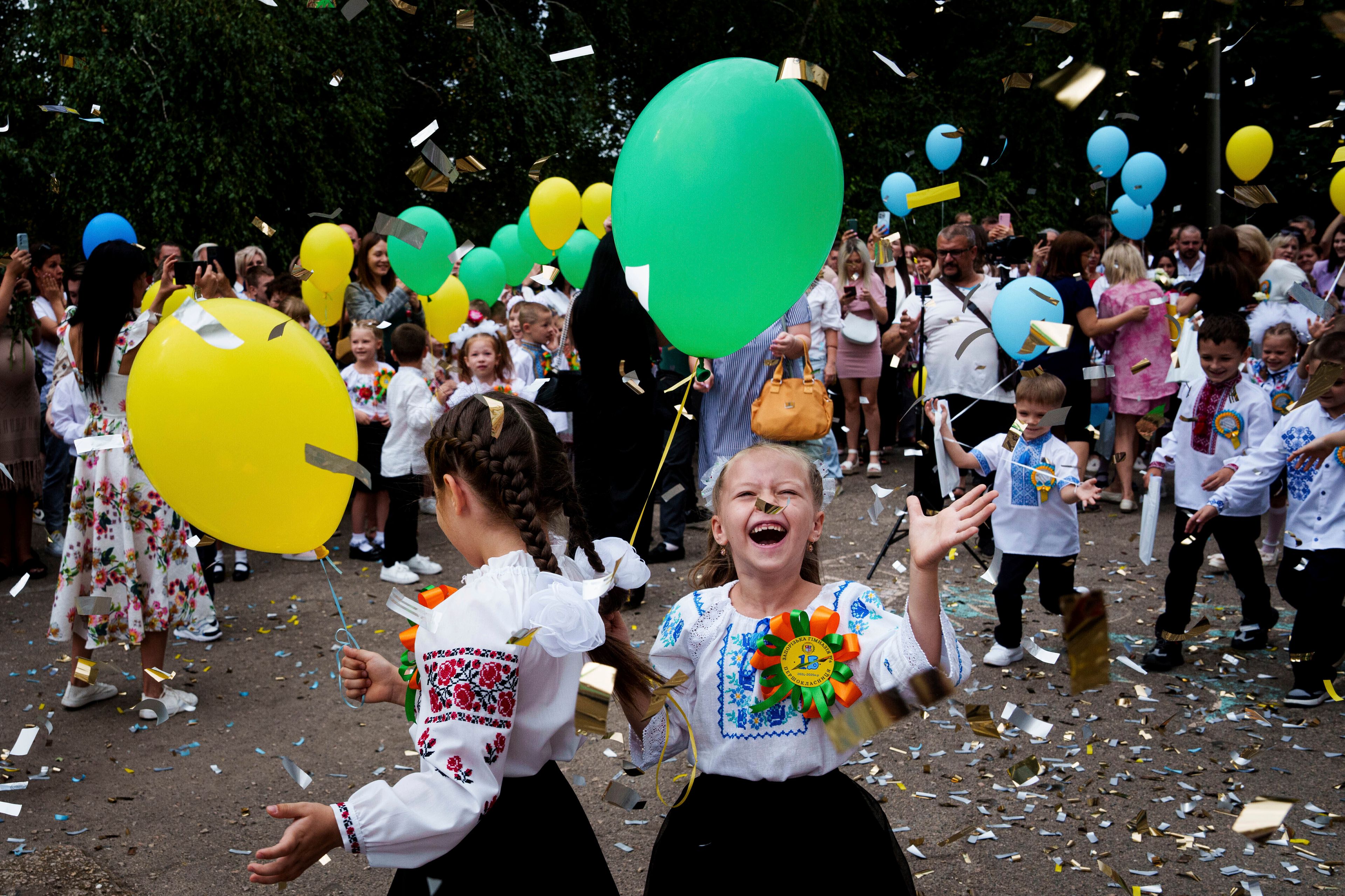 First-graders attend the traditional ceremony for the first day of school in Zaporizhzhia, Ukraine, Sunday Sept. 1, 2024. (AP Photo/Evgeniy Maloletka)