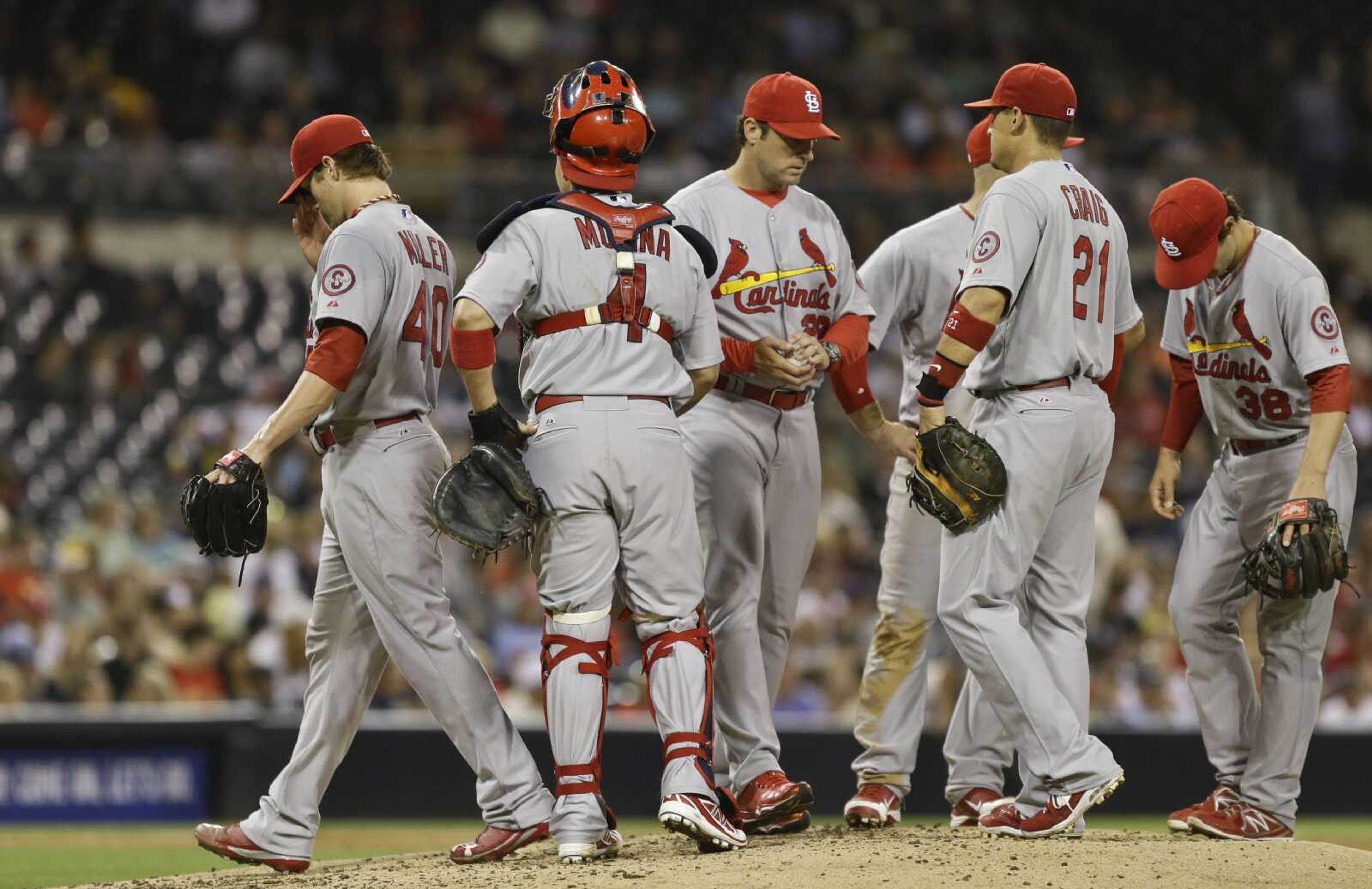 St. Louis Cardinals starting pitcher Shelby Miller, left, leaves the mound after being relieved by manger Mike Matheny in the sixth inning after throwing 107 pitches against the San Diego Padres in a baseball game in San Diego, Monday, May 20, 2013. Miller left with the lead but the Cardinals bullpen allowed two runs in the sixth inning to surrender the lead. (AP Photo/Lenny Ignelzi)