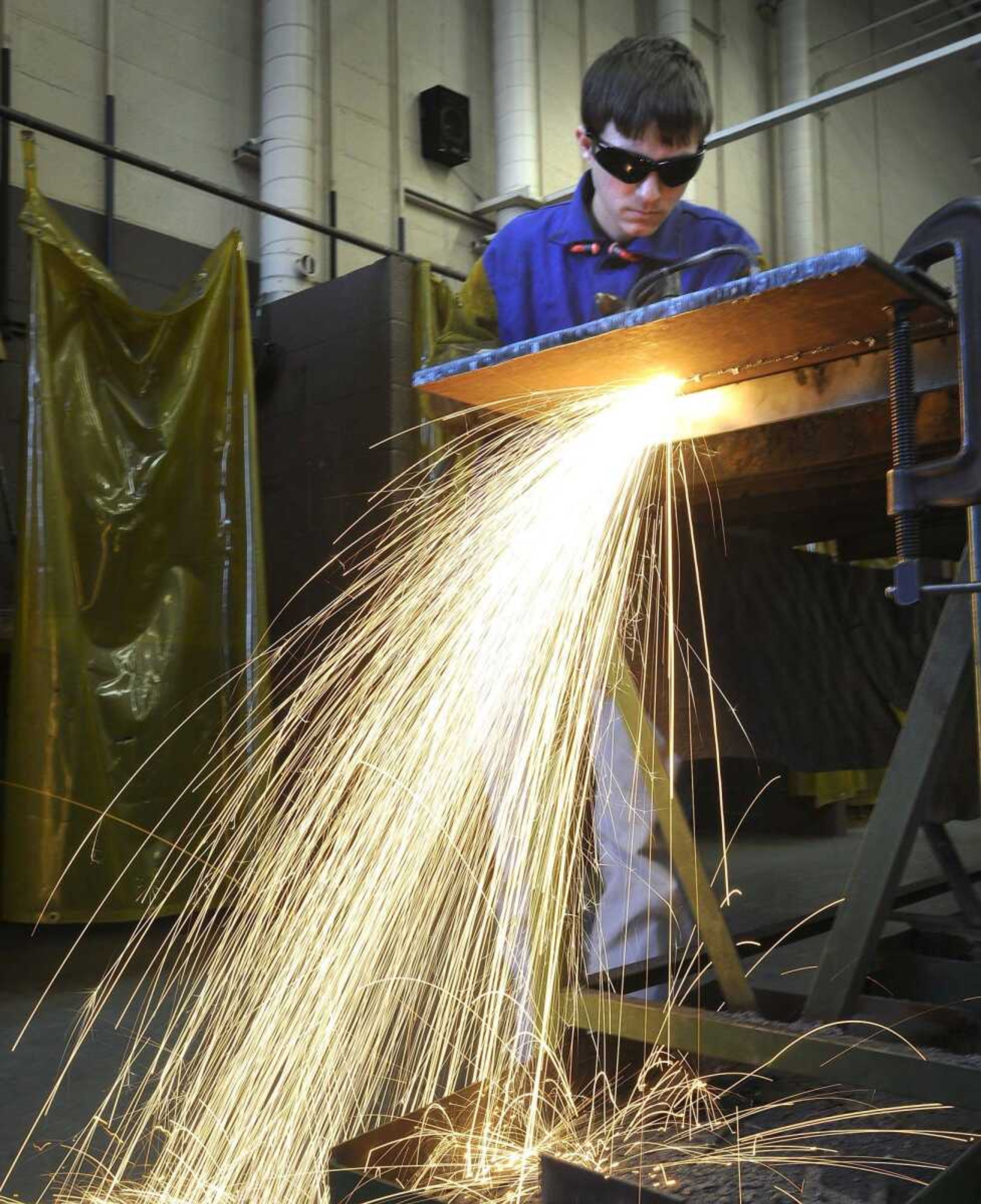 Tyler Bock of Millersville uses an oxygen-acetylene cutting torch on steel Monday during a welding class at the Cape Girardeau Career and Technology Center. (Fred Lynch)