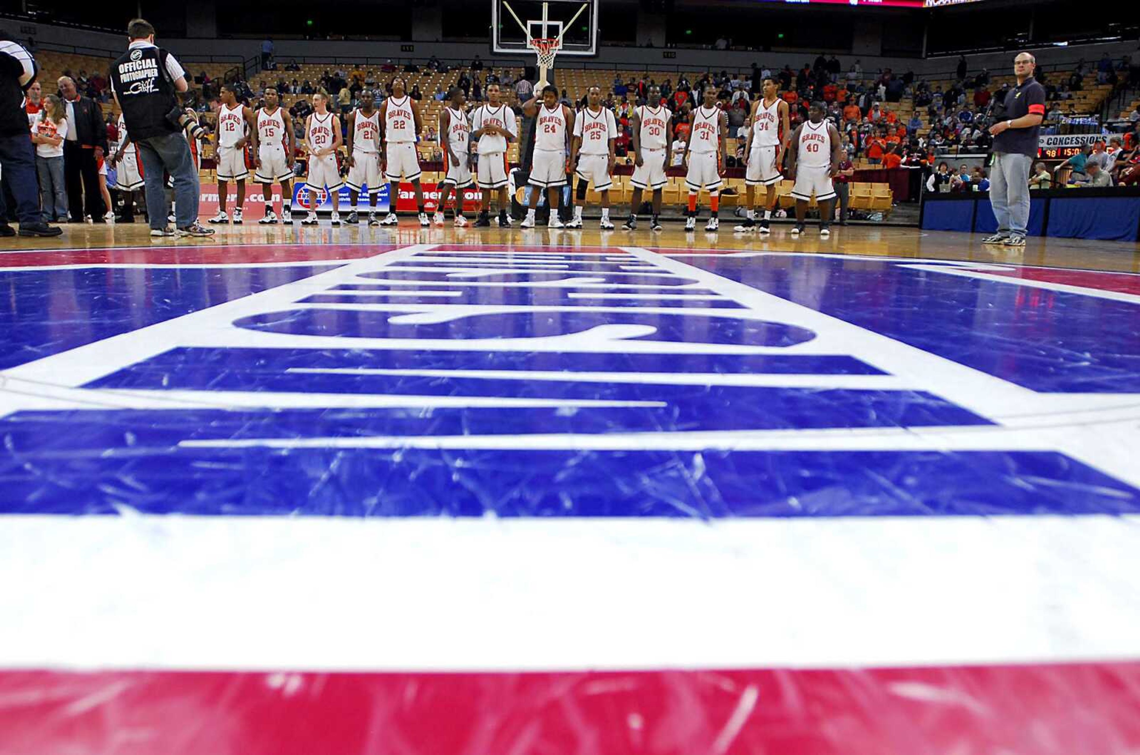 KIT DOYLE ~ kdoyle@semissourian.com
The Scott County Central Braves line up to receive medals Saturday, March 21, 2009, following the Class 1 state championship win at Mizzou Arena in Columbia.  Thomas finished with 29 points.