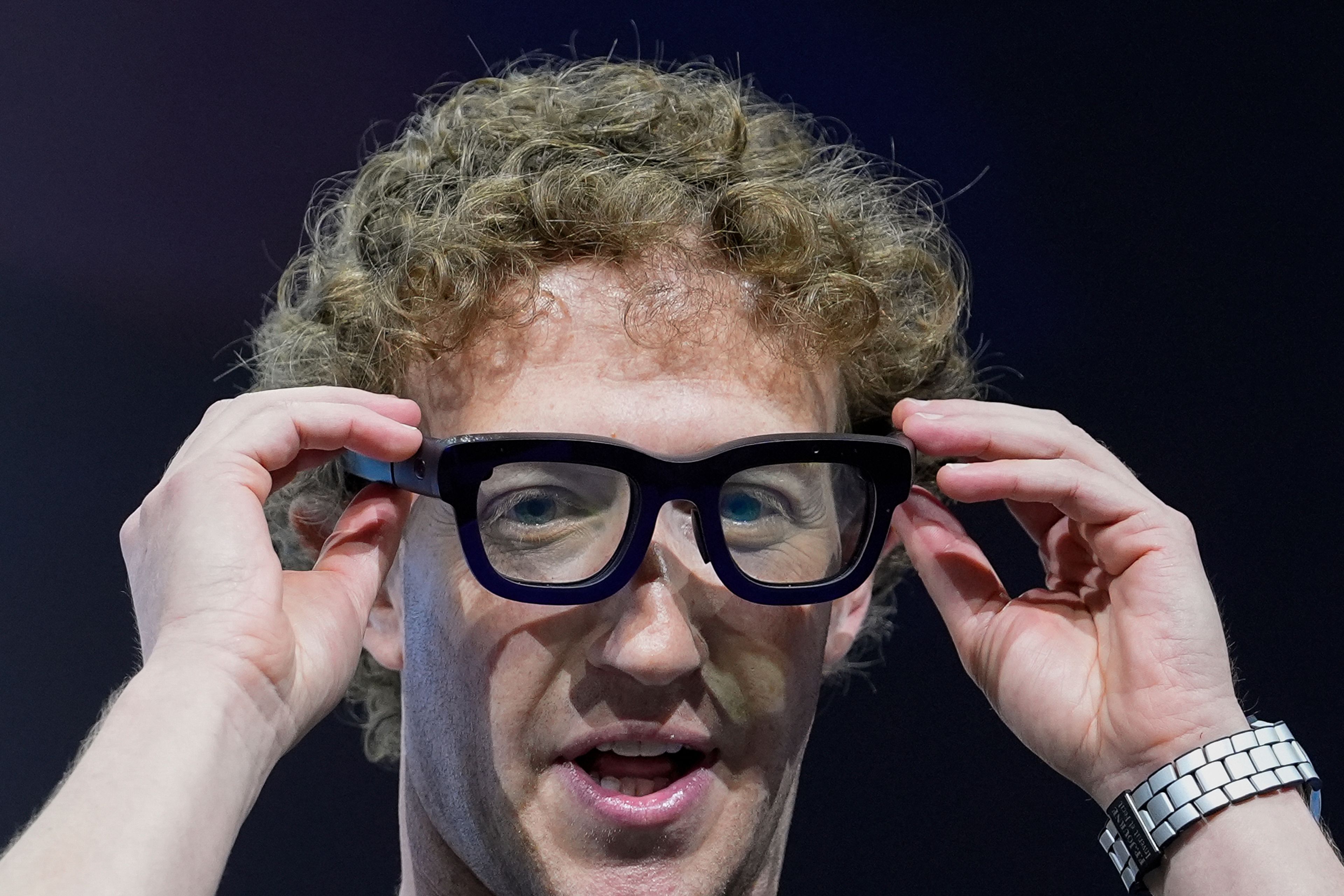 Mark Zuckerberg wears a pair of Orion AR glasses during the Meta Connect conference Wednesday, Sept. 25, 2024, in Menlo Park, Calif. (AP Photo/Godofredo A. Vásquez)