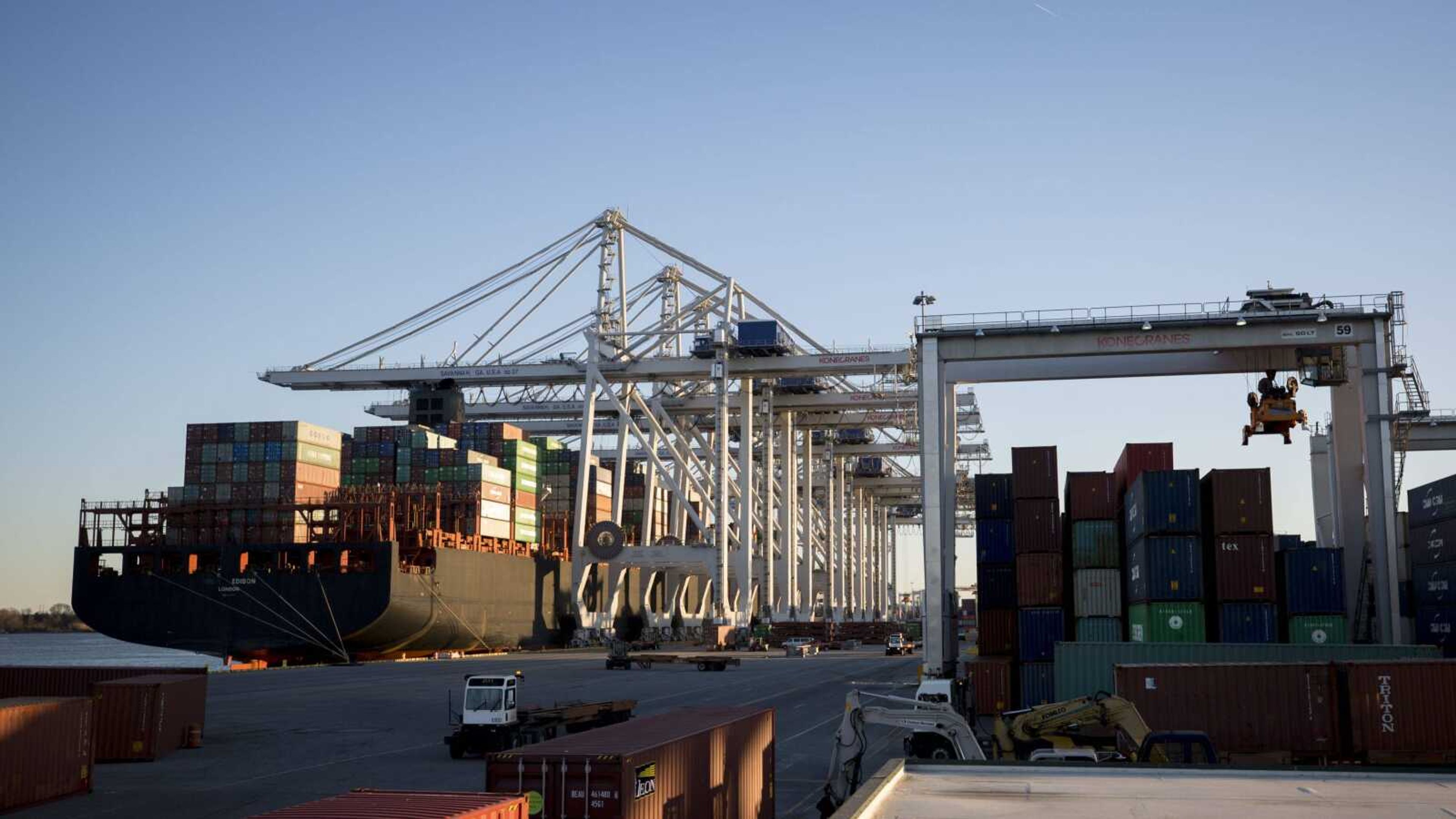 Cranes at the Georgia Ports Authority's Port of Savannah load and unload containers in Savannah, Georgia.