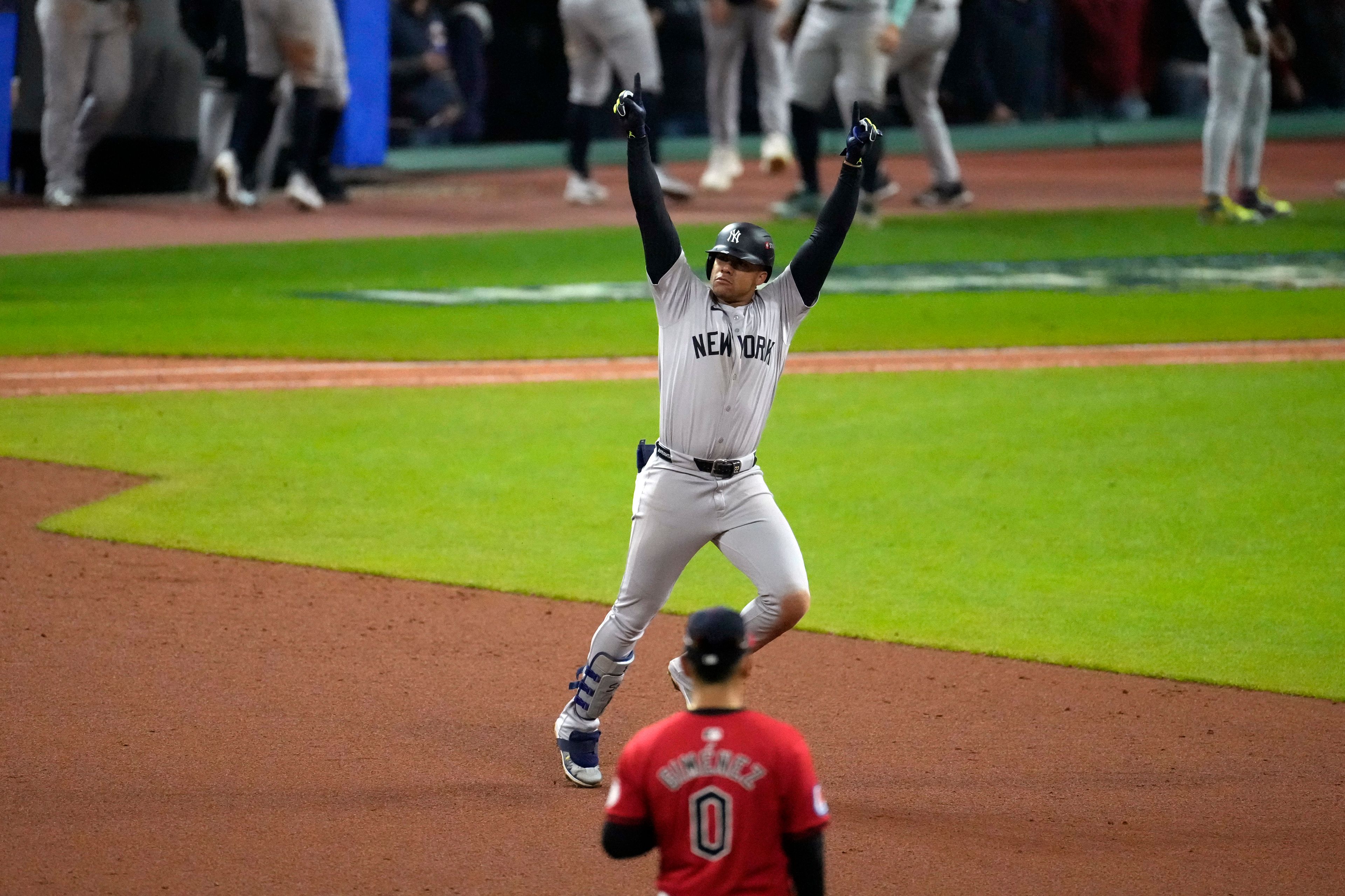 New York Yankees' Juan Soto celebrates after hitting a three-run home run against the Cleveland Guardians during the 10th inning in Game 5 of the baseball AL Championship Series Saturday, Oct. 19, 2024, in Cleveland. (AP Photo/Jeff Roberson)