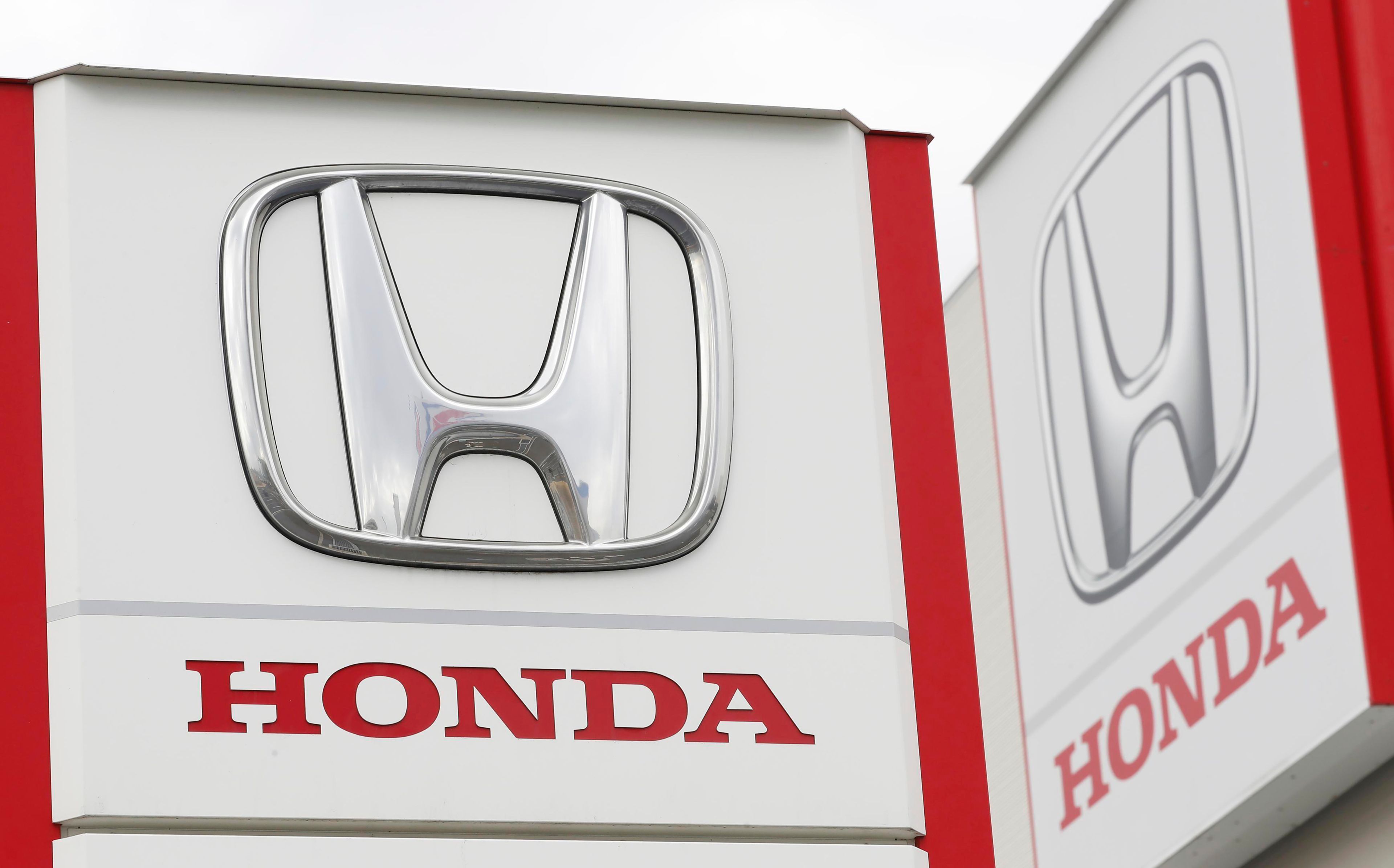 FILE - Logos of Honda Motor Co. are pictured in Tsukuba, northeast of Tokyo, Feb. 13, 2019. (Kyodo News via AP, File)