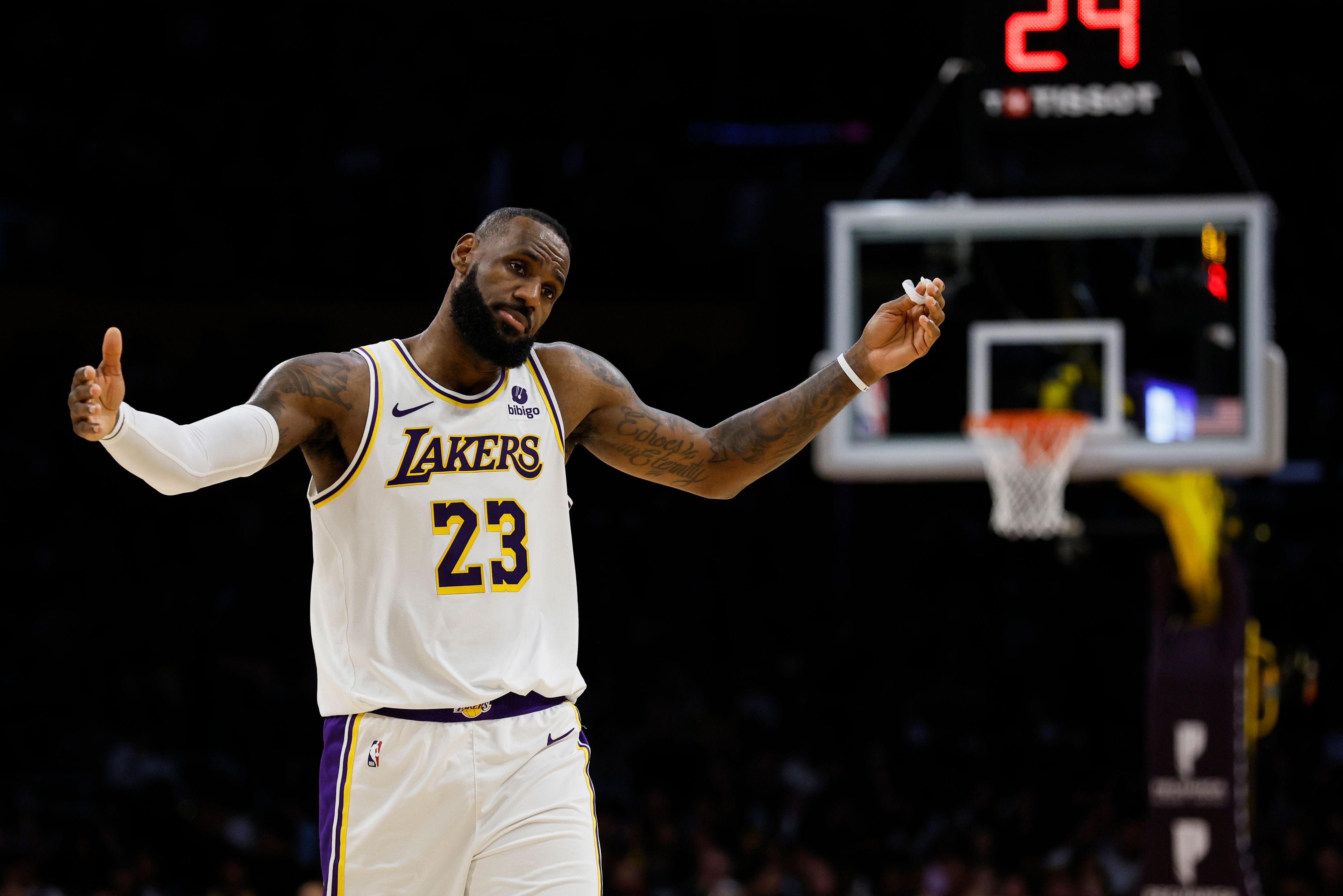 FILE - Los Angeles Lakers forward LeBron James (23) reacts during the first half of an NBA basketball game against the Indiana Pacers, Sunday, March 24, 2024, in Los Angeles. (AP Photo/Etienne Laurent, File)