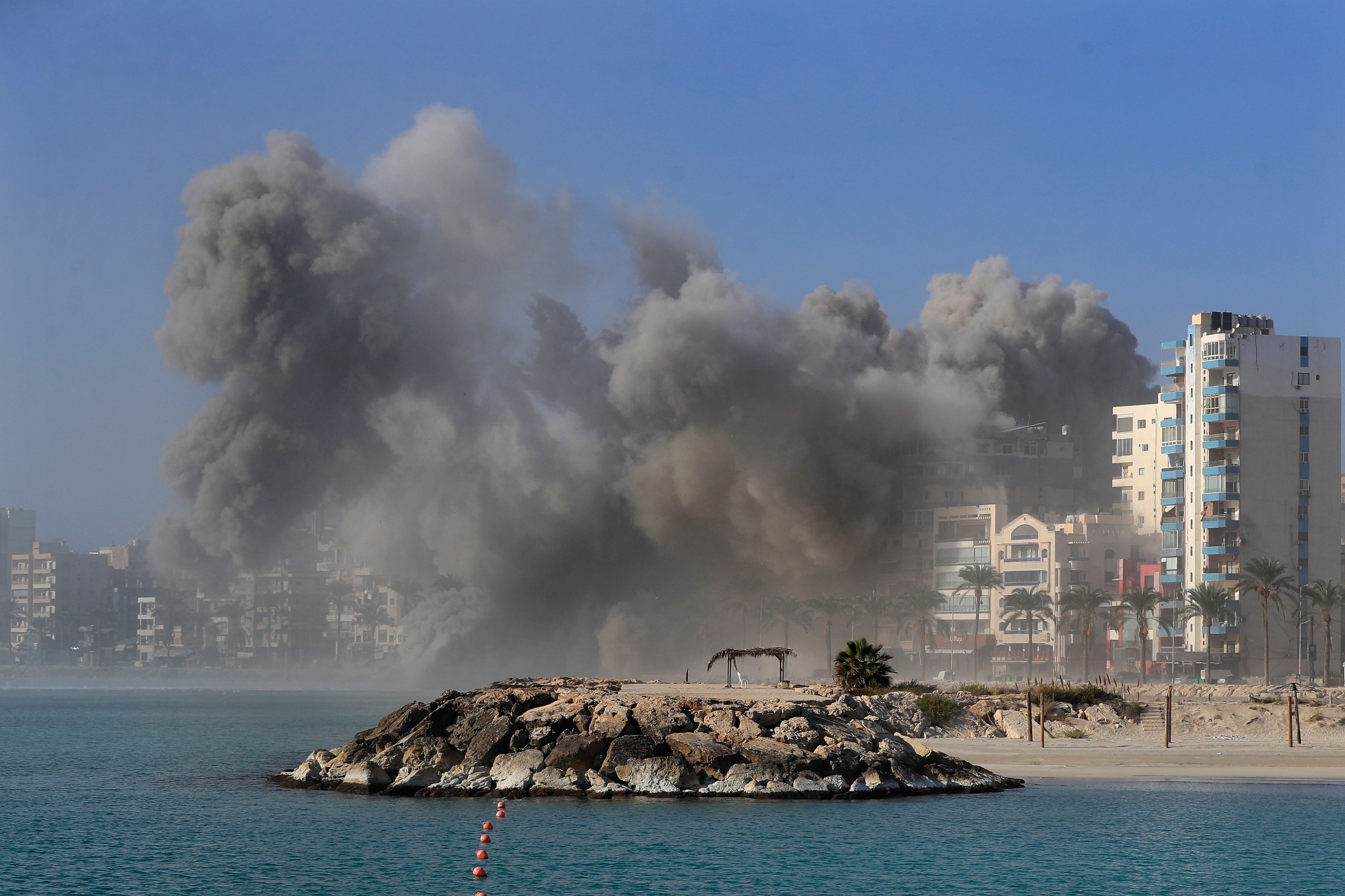 FILE - Smoke rises from buildings hit in Israeli airstrikes in Tyre, southern Lebanon, Monday, Oct. 28, 2024. (AP Photo/Mohammad Zaatari, File)