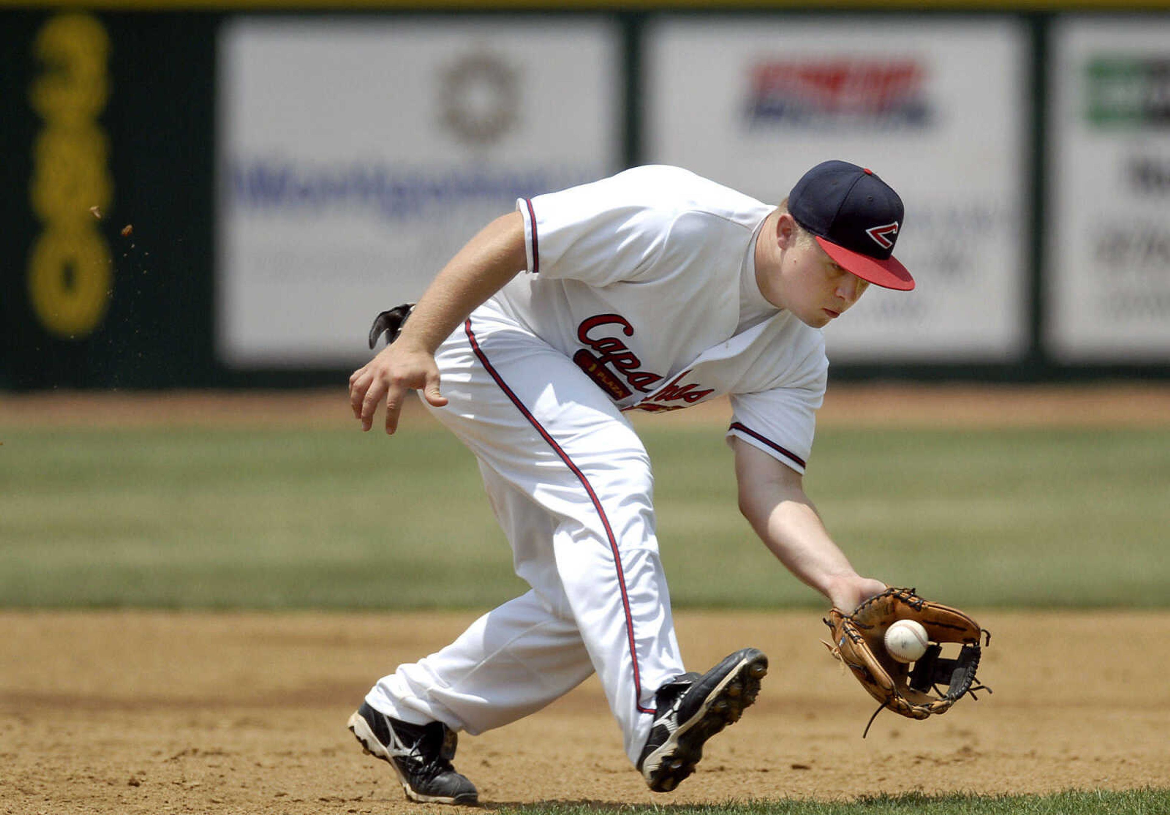 KIT DOYLE ~ kdoyle@semissourian.com
Capahas third baseman Josh Eftink watches a grounder into his glove Saturday, June 13, 2009, at Capaha Field.