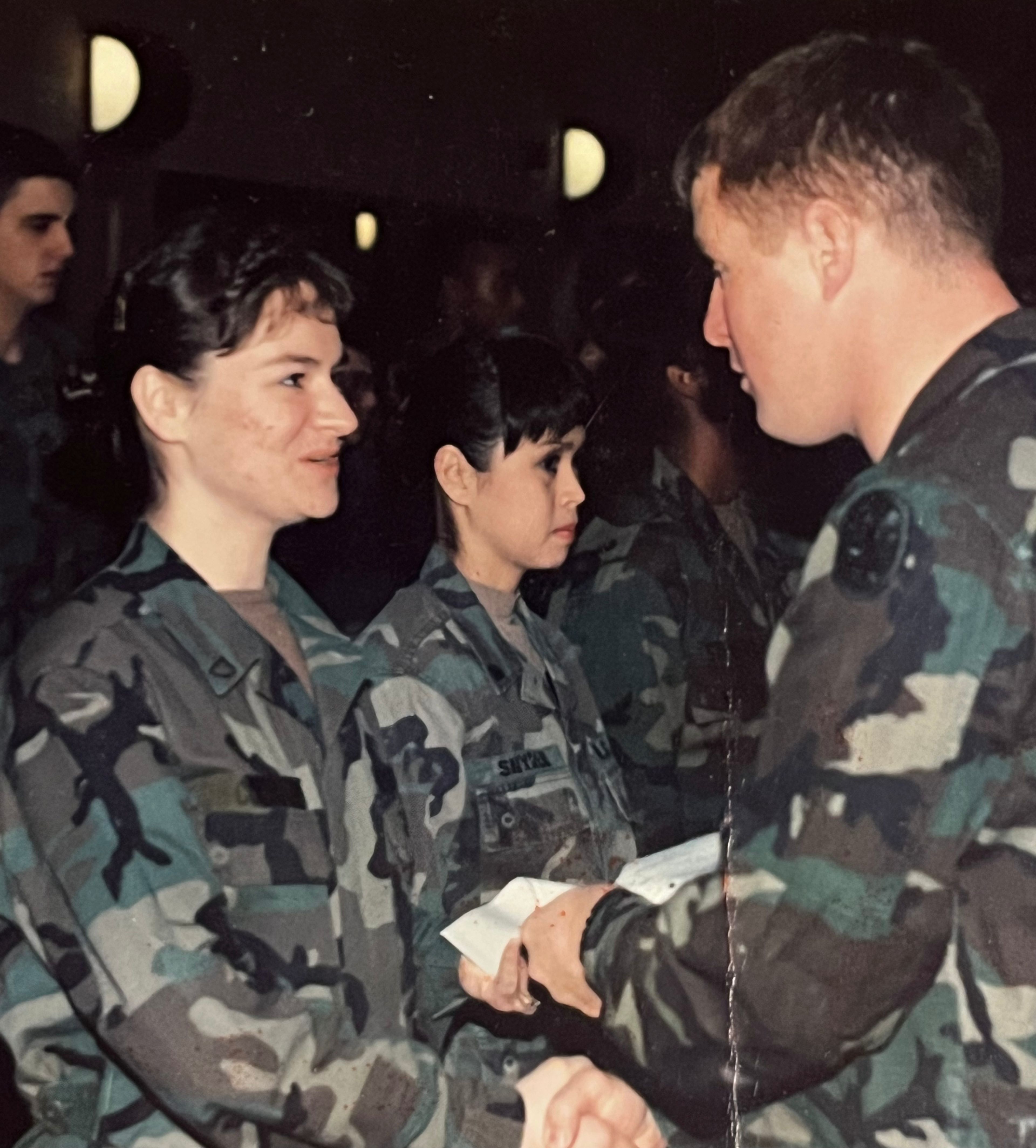 Peggy Stieneke is presented with a promotion to Private First Class during her time in the United States Army. 