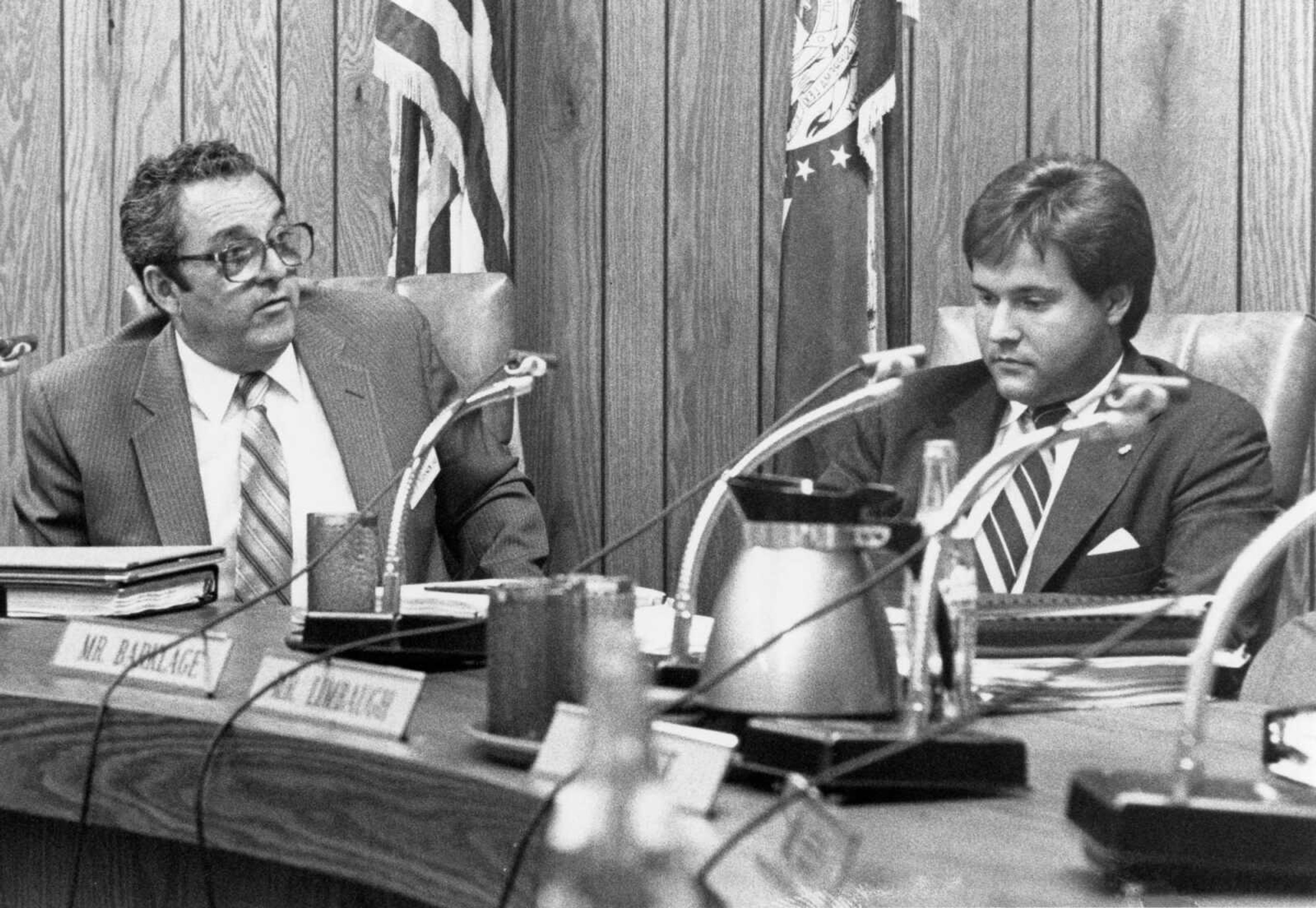 Published Sept. 9, 1987.
Mayor Gene Rhodes, left, reacted to concerns raised by some City Council members, including David Barklage, right, over the fact that a company in which the mayor was a shareholder had yet to obtain federal and city permits in connection with development of an industrial park along Highway 74. The issue was raised at a council meeting. (Mark Bliss ~ Southeast Missourian archive)