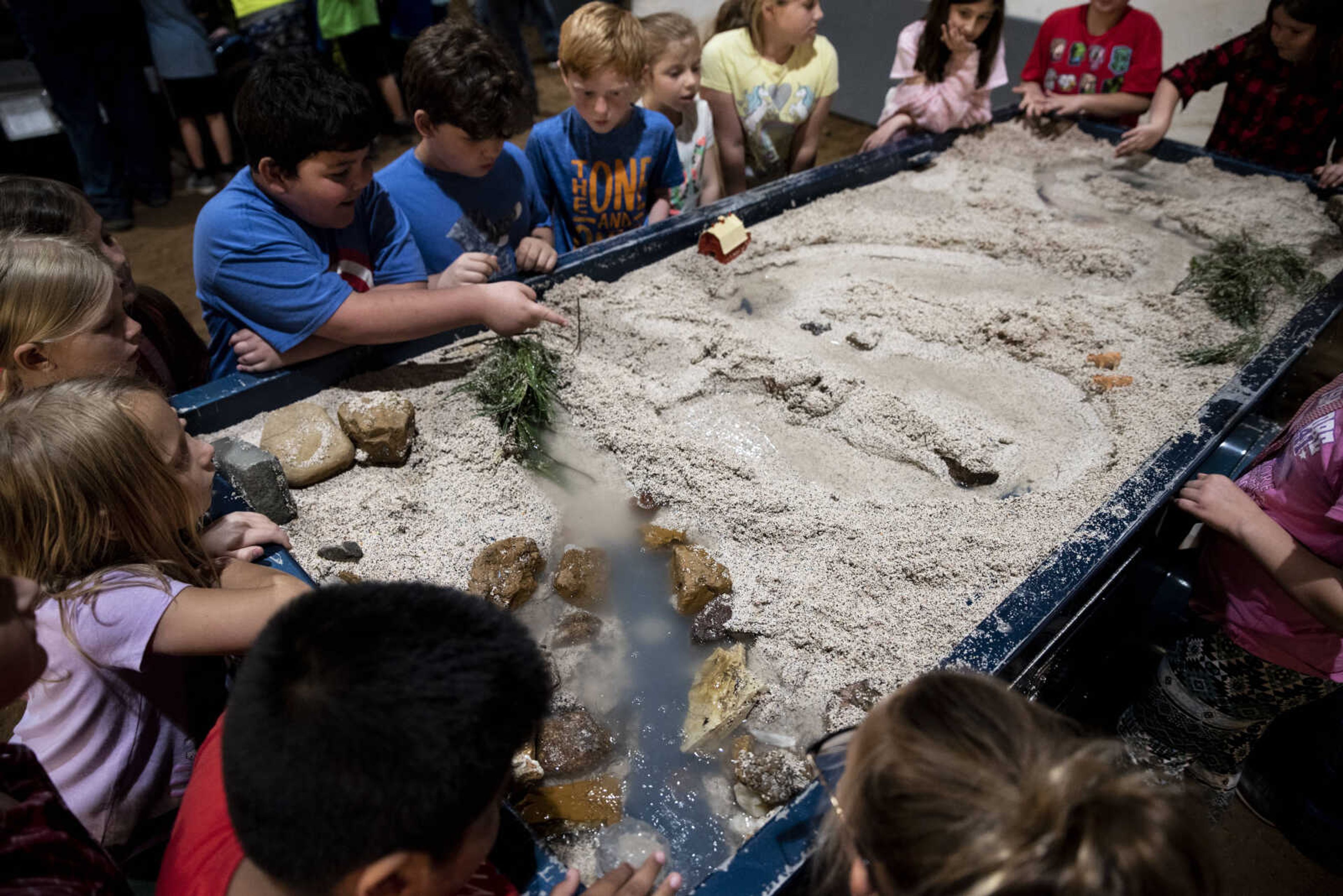 Second grade students from Perryville watch a stream table demonstration during the 24th annual Farm Day sponsored by the Southeast Missouri Cattlemen's Association at Flickerwood Arena Wednesday, April 24, 2019, in Jackson. Over 800 students attended Farm Day and learned about a variety of farm-related topics from forestry to soil conservation, as well as farm animals and honey bees.