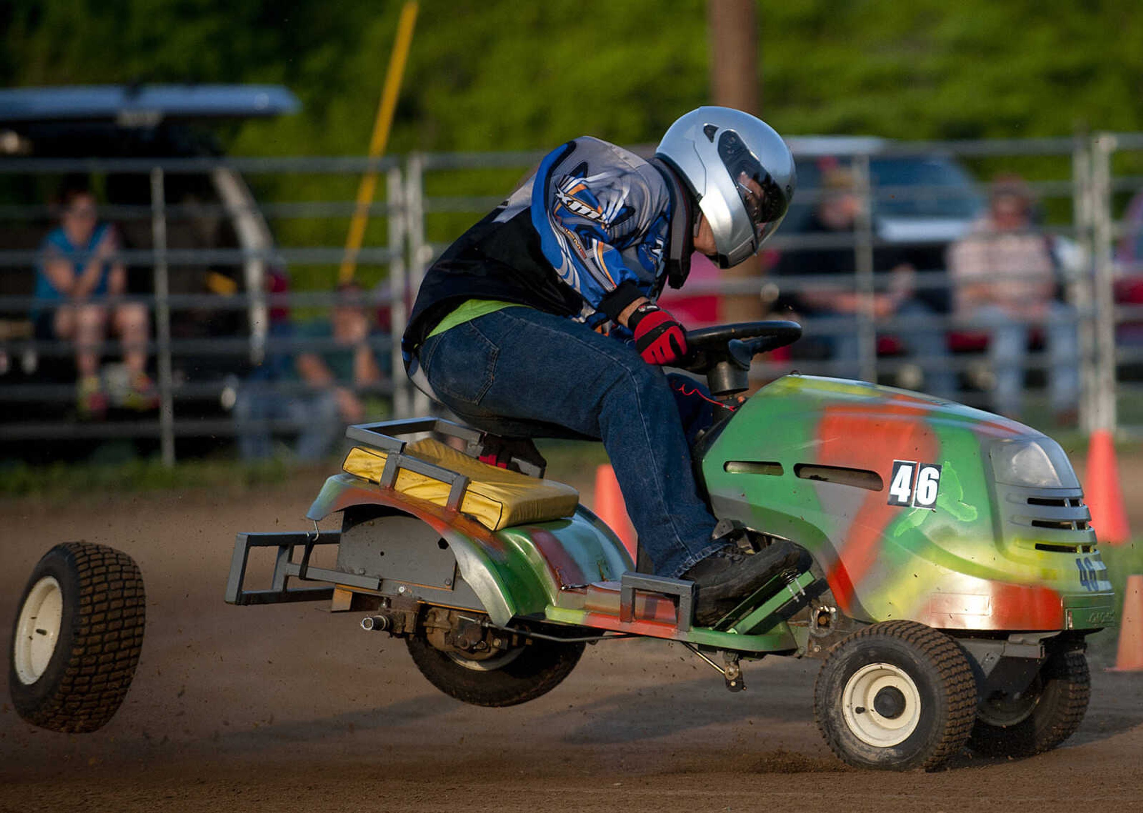 Vernon Yount loses his back wheel in turn three during the C Class heat during the Southeast Missouri Lawnmower Racing Association's Racing for a Cure presented by the Patton Lions Club at the Patton Saddle Club Saturday, May 10, in Patton, Mo.