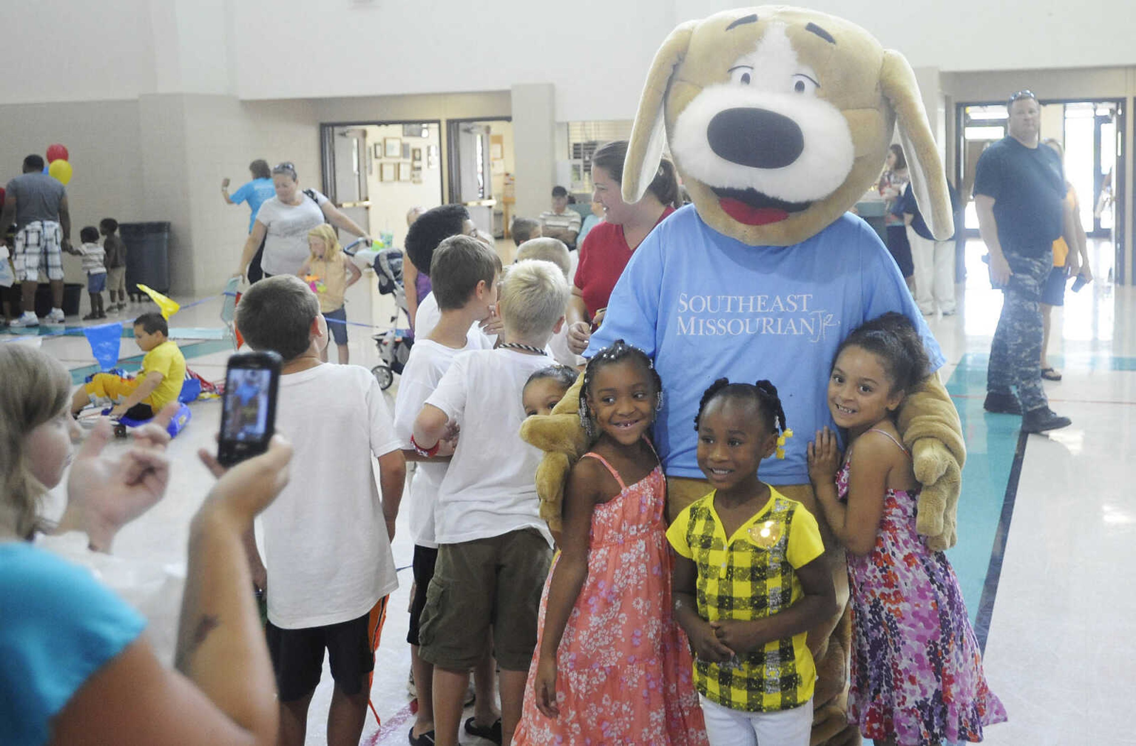 ADAM VOGLER ~ avogler@semissourian.com
Children surround Tracker wanting hugs during the 11th annual Cape Girardeau Parks and Rec Day Friday, July 13, at the Osage Center.