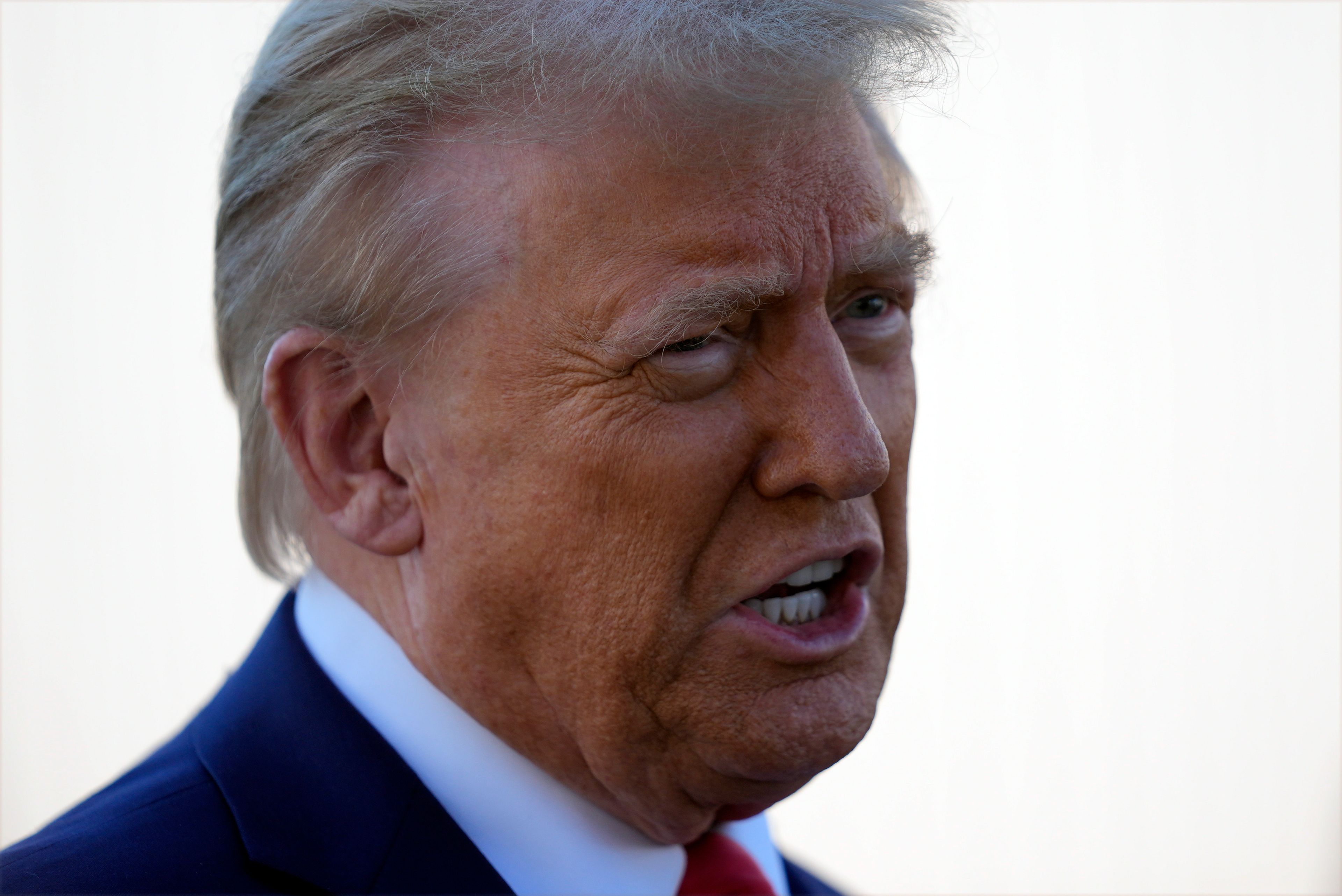 Republican presidential nominee former President Donald Trump talks with reporters as he arrives at Harrisburg International Airport, Sunday, Oct. 20, 2024, in Harrisburg, Pa. (AP Photo/Evan Vucci)