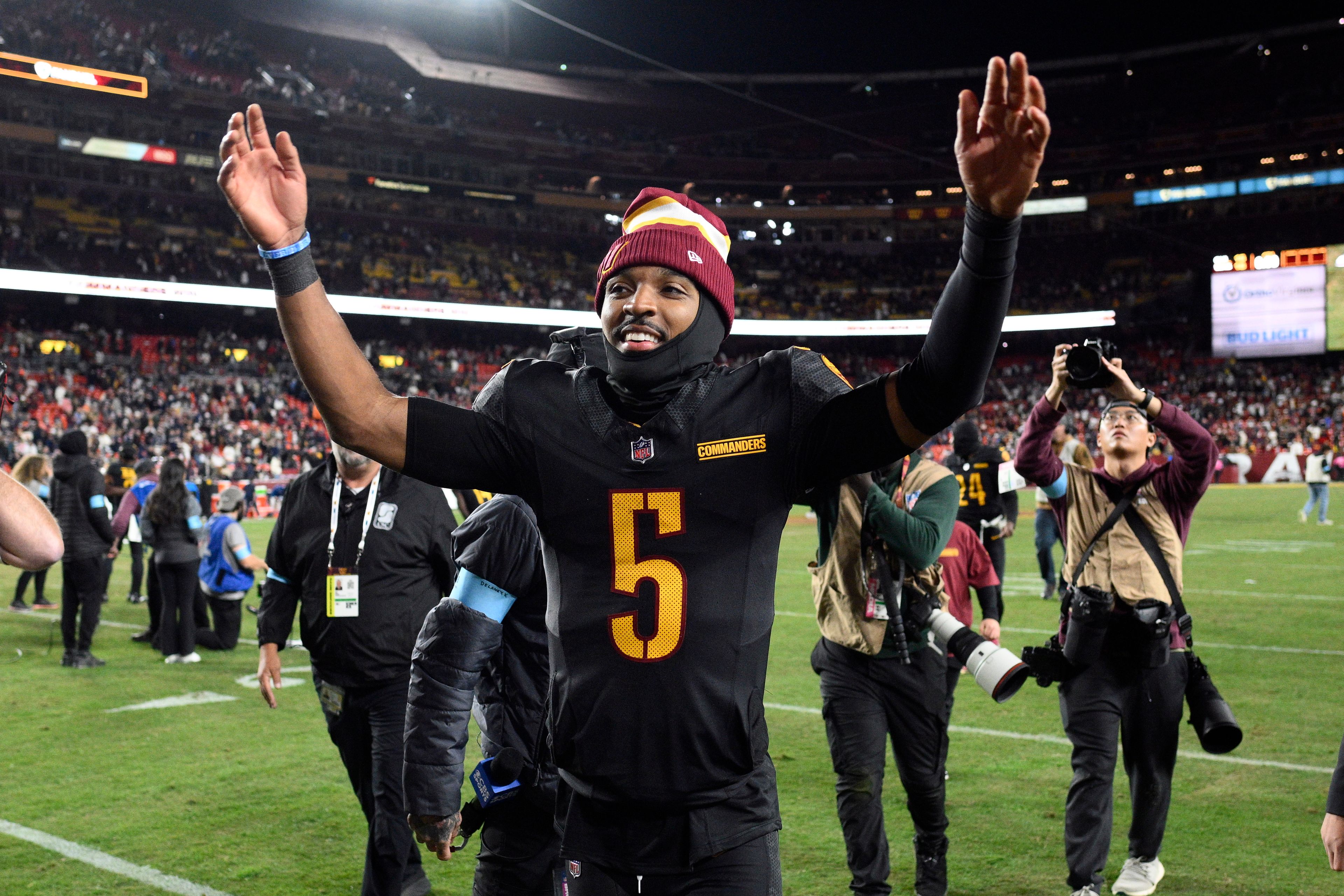 Washington Commanders quarterback Jayden Daniels (5) leaves the field after an 18-15 win over the Chicago Bears in an NFL football game Sunday, Oct. 27, 2024, in Landover, Md. (AP Photo/Nick Wass)