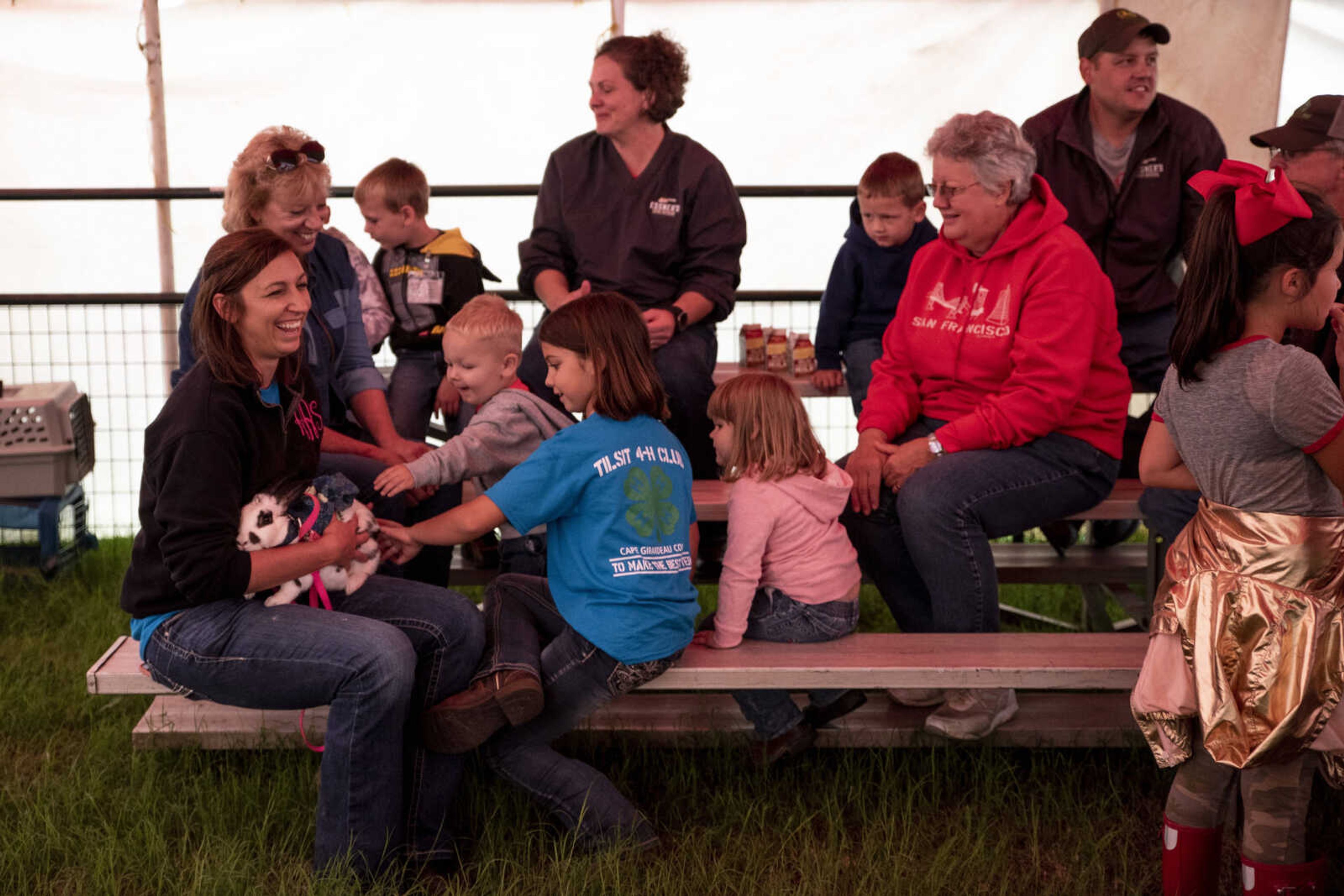 Fairgoers mingle before the start of the Poultry and Rabbit Dress-Up Contest at the SEMO District Fair Sunday, Sept. 9, 2018 in Cape Girardeau.