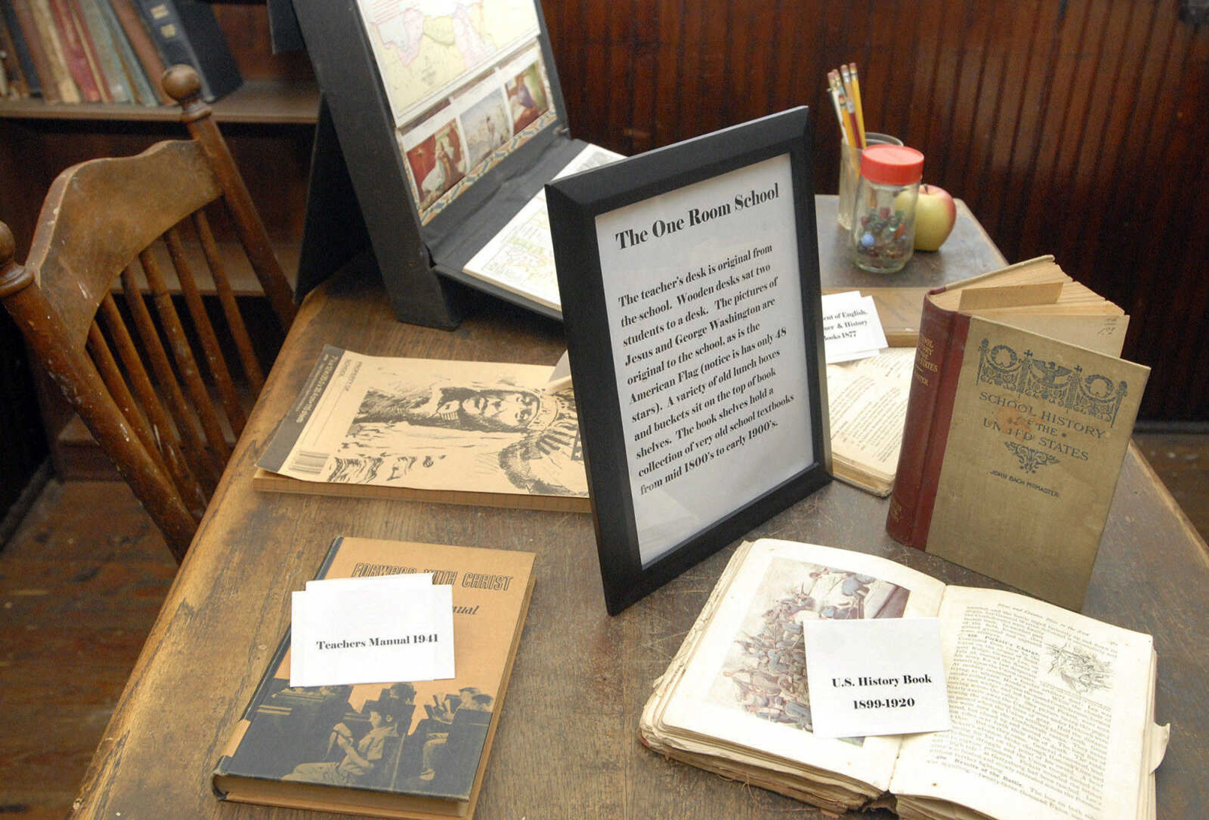 LAURA SIMON ~ lsimon@semissourian.com
An old teacher's manual and text book are on display on the original teacher's desk inside Hanover Lutheran's one-room school house Wednesday, February 1, 2012 in Cape Girardeau. The building operated as a school for grades 1-8 from 1924-1955.