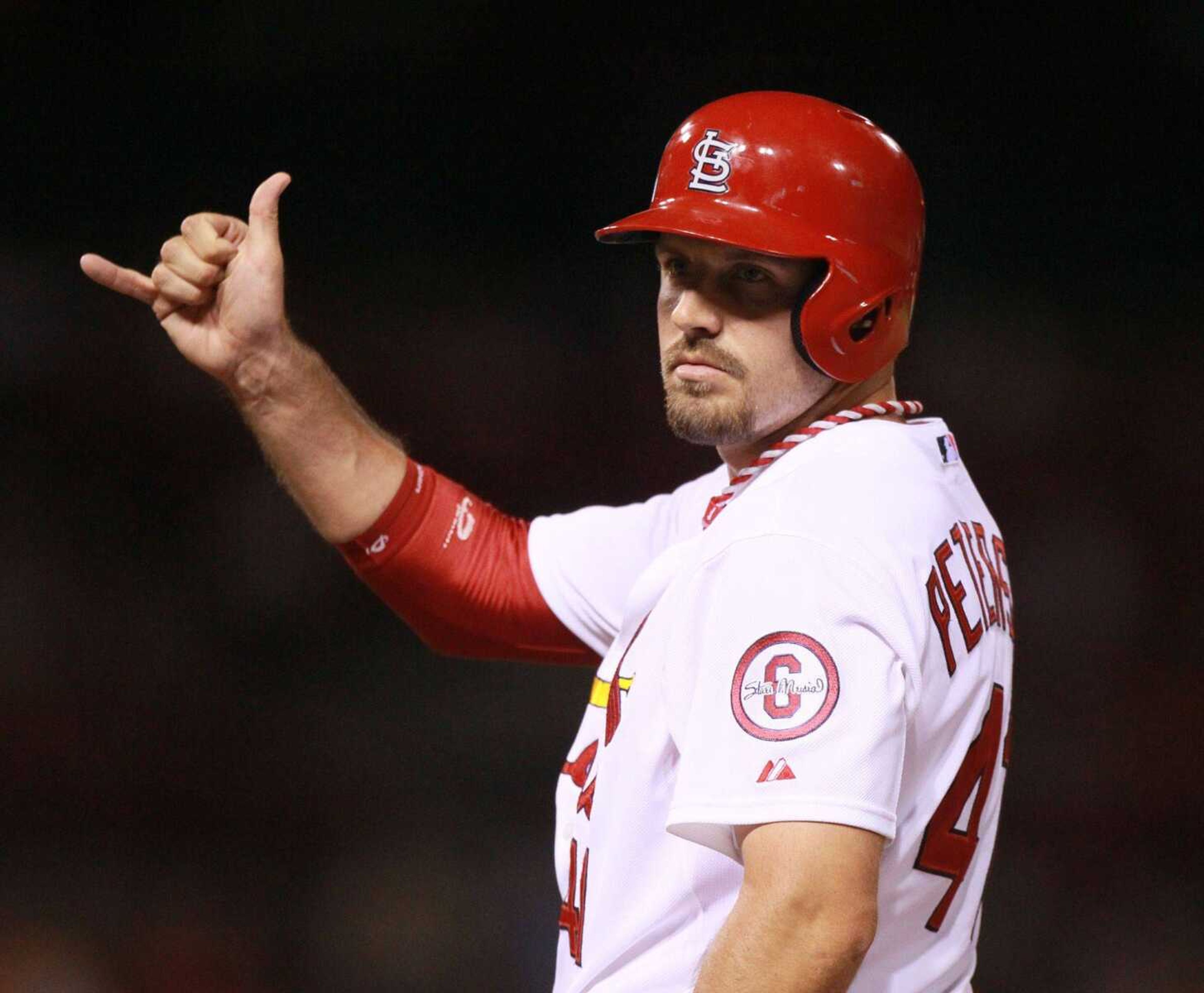 St. Louis Cardinals pinch-hitter Brock Peterson signals to the dugout after driving in a run with his first hit in the majors, in the eighth inning during a baseball game against the Philadelphia Phillies on Wednesday, July 24, 2013, at Busch Stadium in St. Louis. (AP Photo/St. Louis Post-Dispatch, Chris Lee) EDWARDSVILLE OUT ALTON OUT