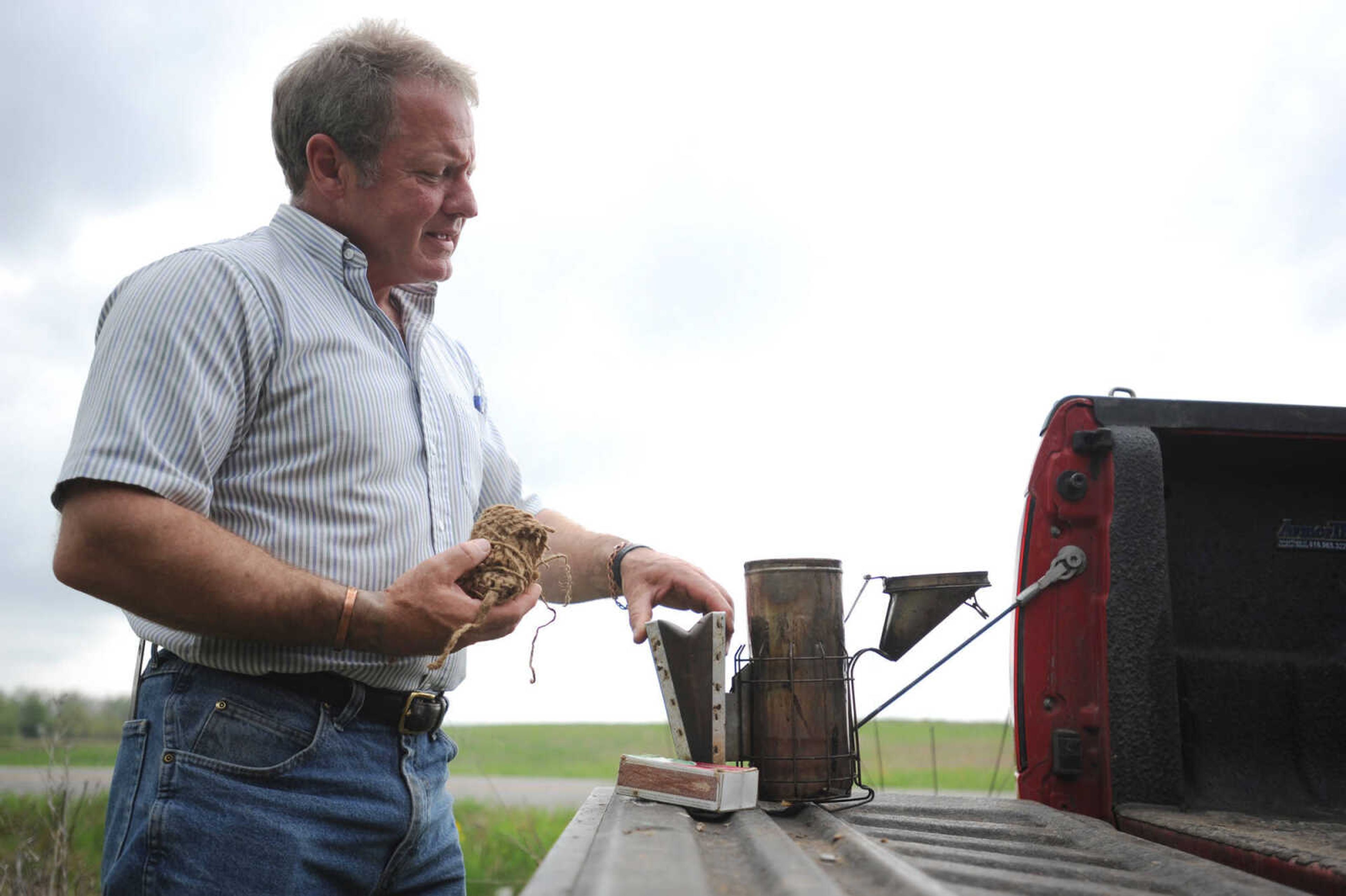 LAURA SIMON ~ lsimon@semissourian.com

Grant Gilliard checks on his beehives in Cape Girardeau County.