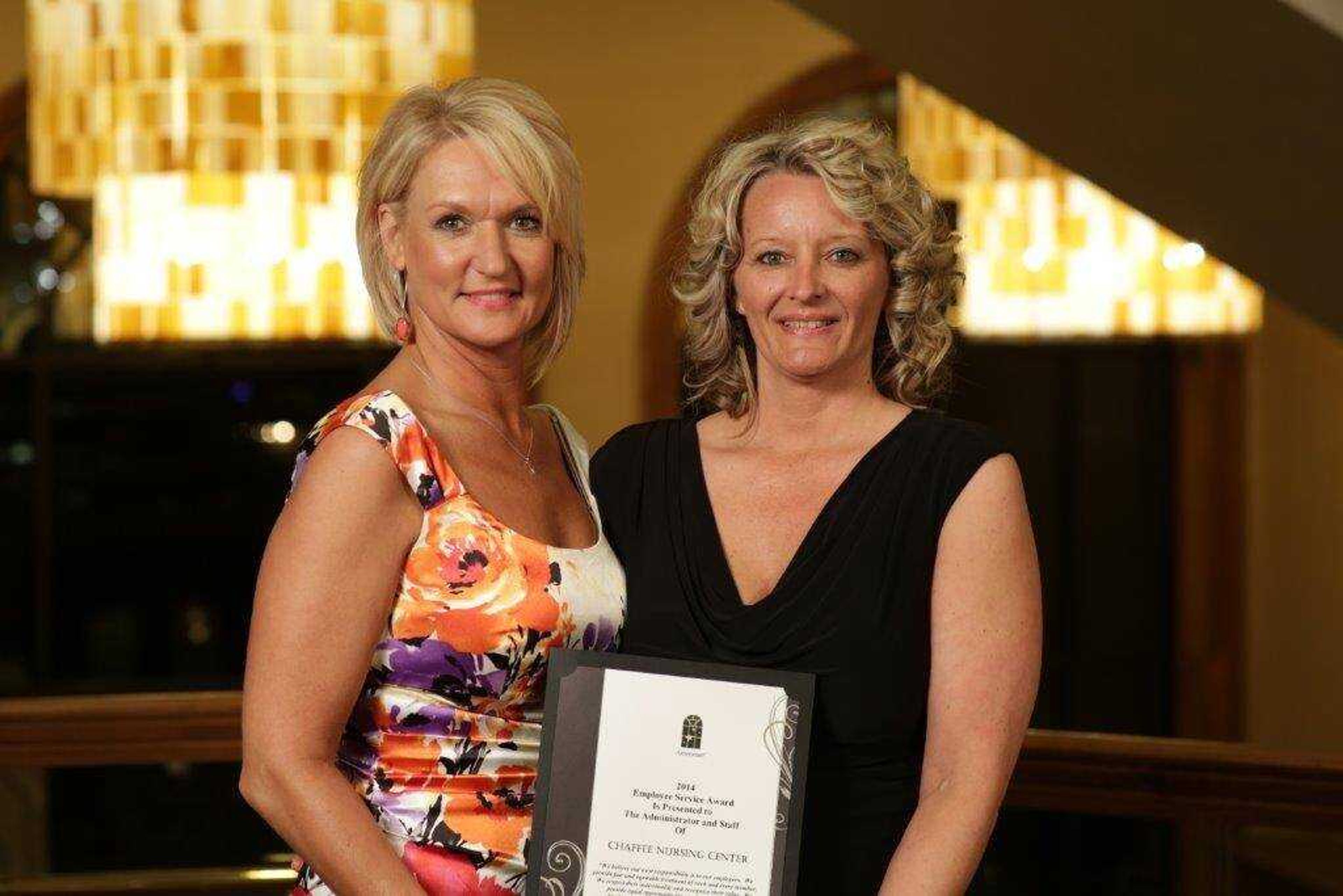 Gail Heisserer, Administrator(left)and Misty Wilhite, Director of Nurisng receiving the Honor Club Award.