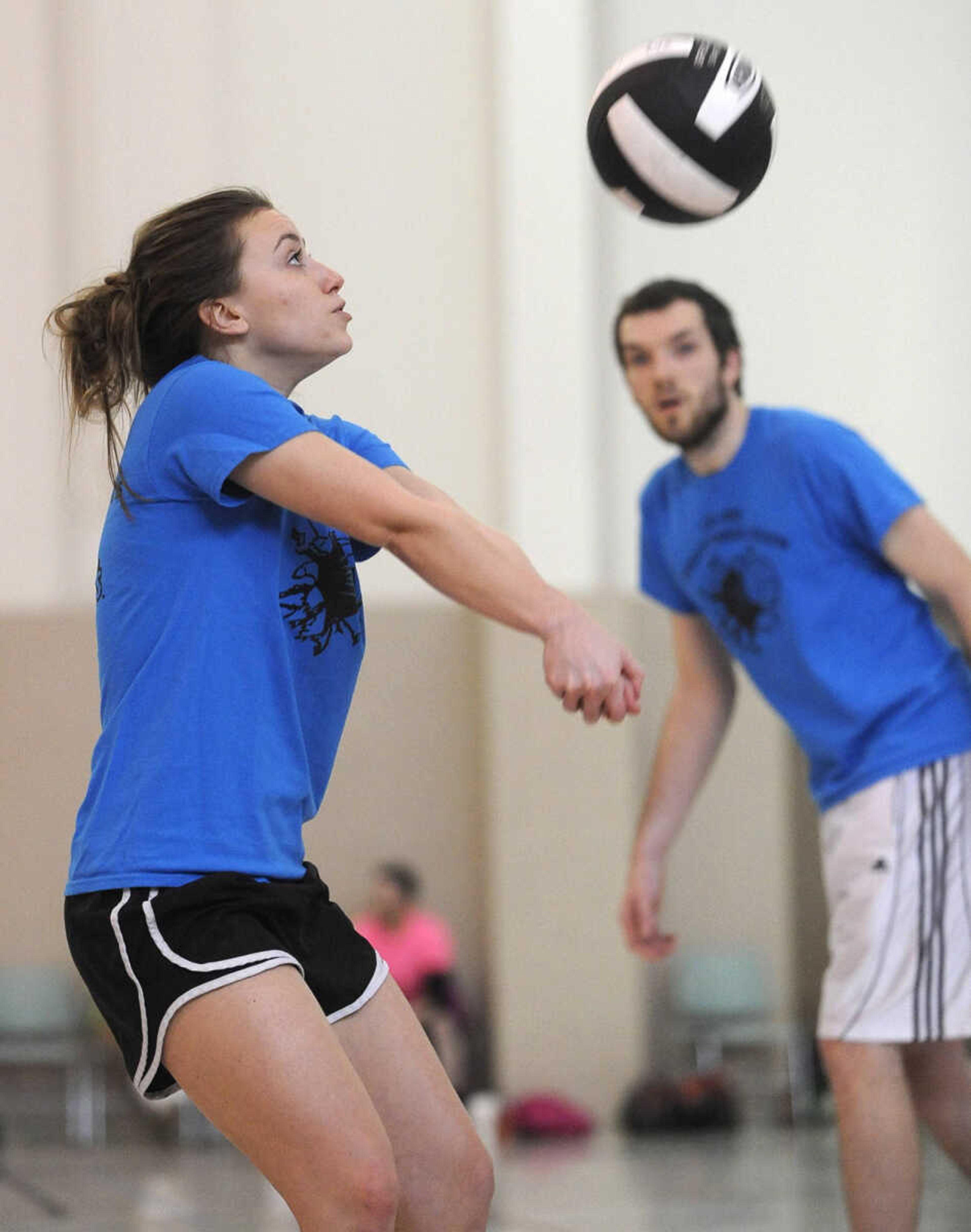 Lauren King sets the ball for The Original Justice League team in the Osage Invitational Co-ed Volleyball Tournament Sunday, March 1, 2015 at the Osage Centre.