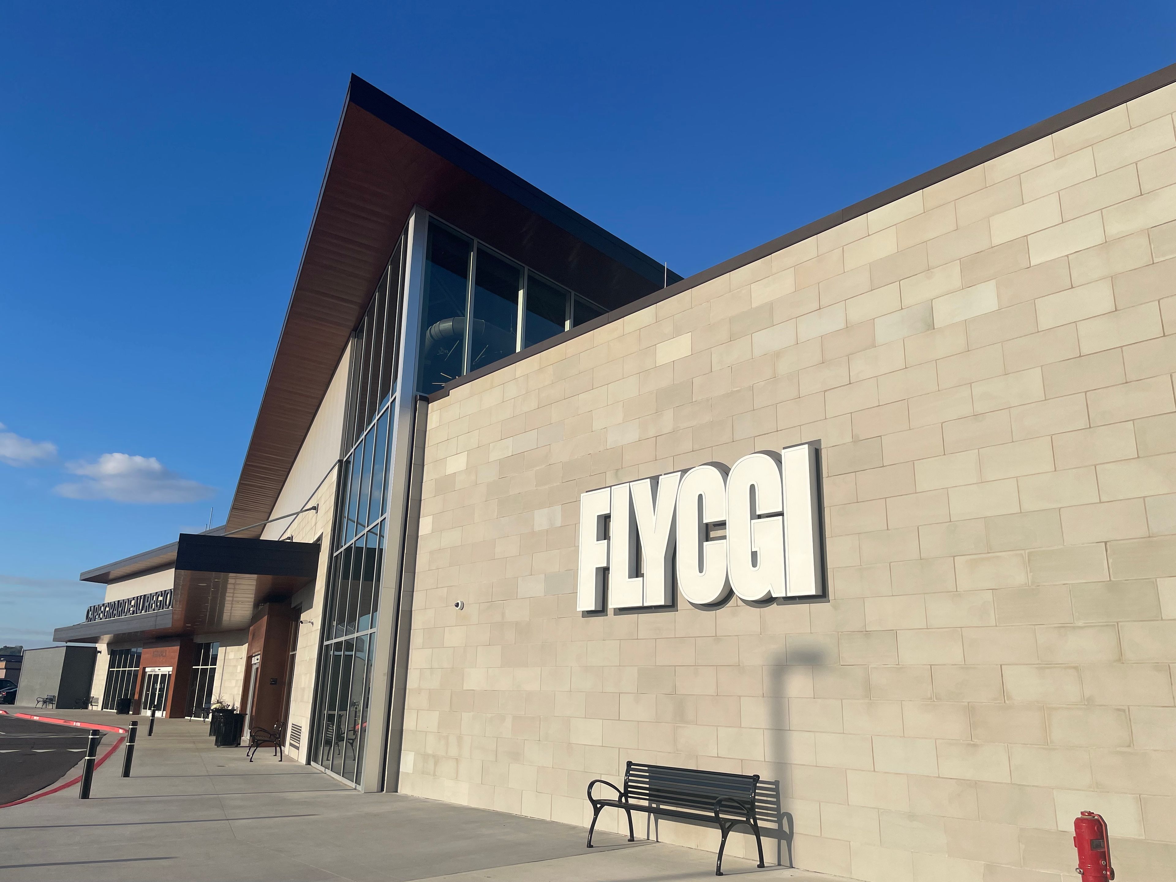 FLYCGI branding on the entrance of the new airport.