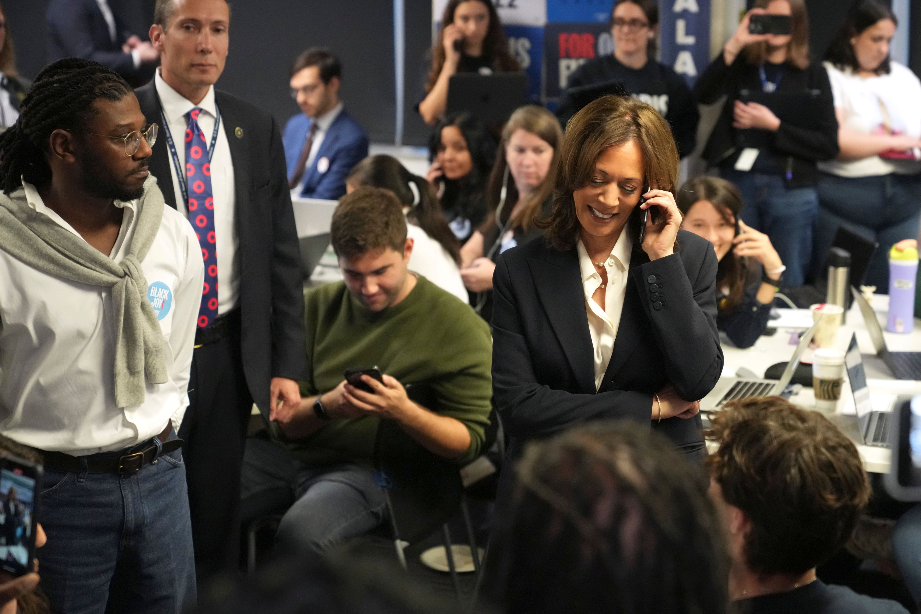 Democratic presidential nominee Vice President Kamala Harris, right, phone banks with volunteers at the DNC headquarters on Election Day, Tuesday, Nov. 5, 2024, in Washington. (AP Photo/Jacquelyn Martin)