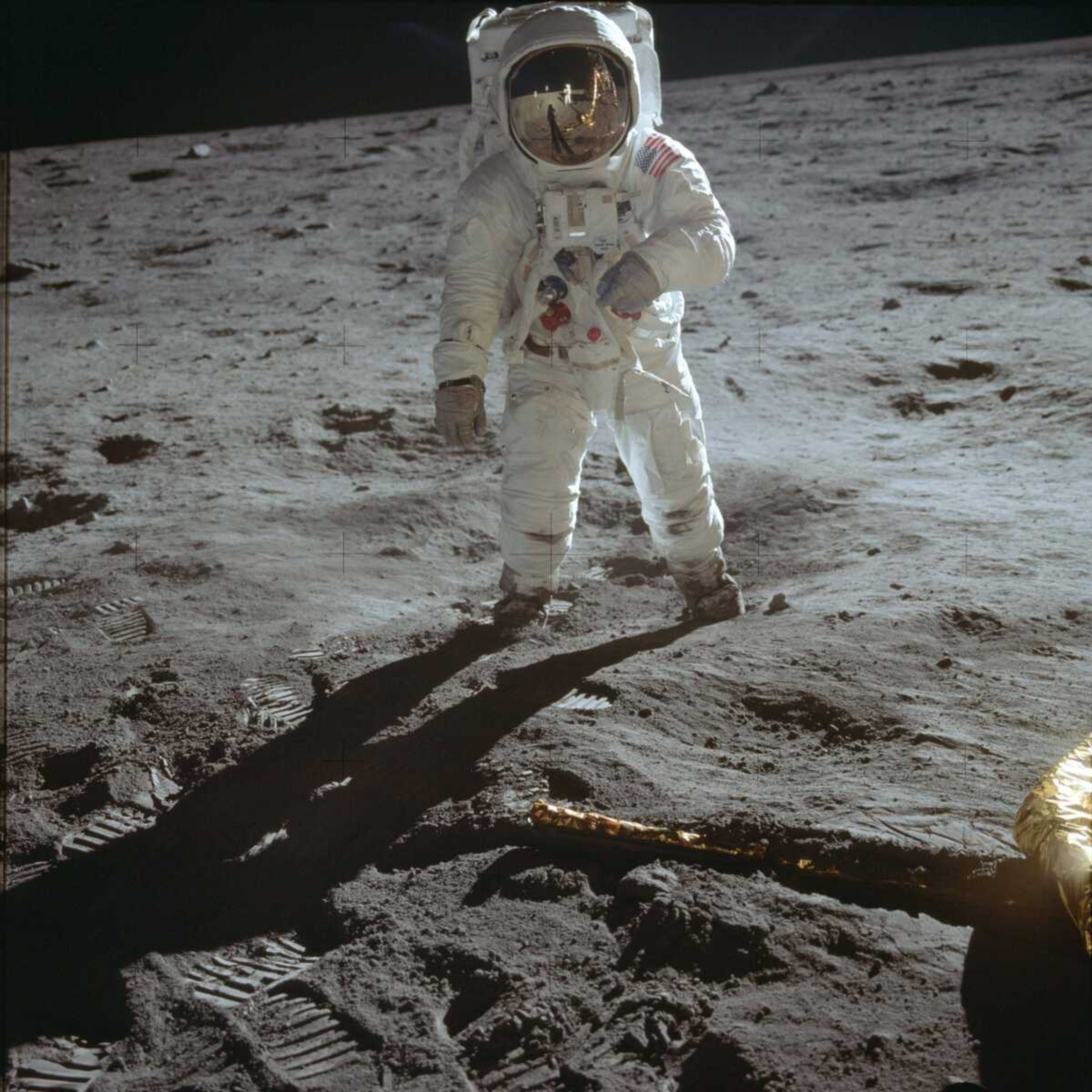 In this July 20, 1969 photo made available by NASA, astronaut Buzz Aldrin, lunar module pilot, walks on the surface of the moon near the leg of the Lunar Module "Eagle" during the Apollo 11 extravehicular activity. (Neil Armstrong/NASA via AP)