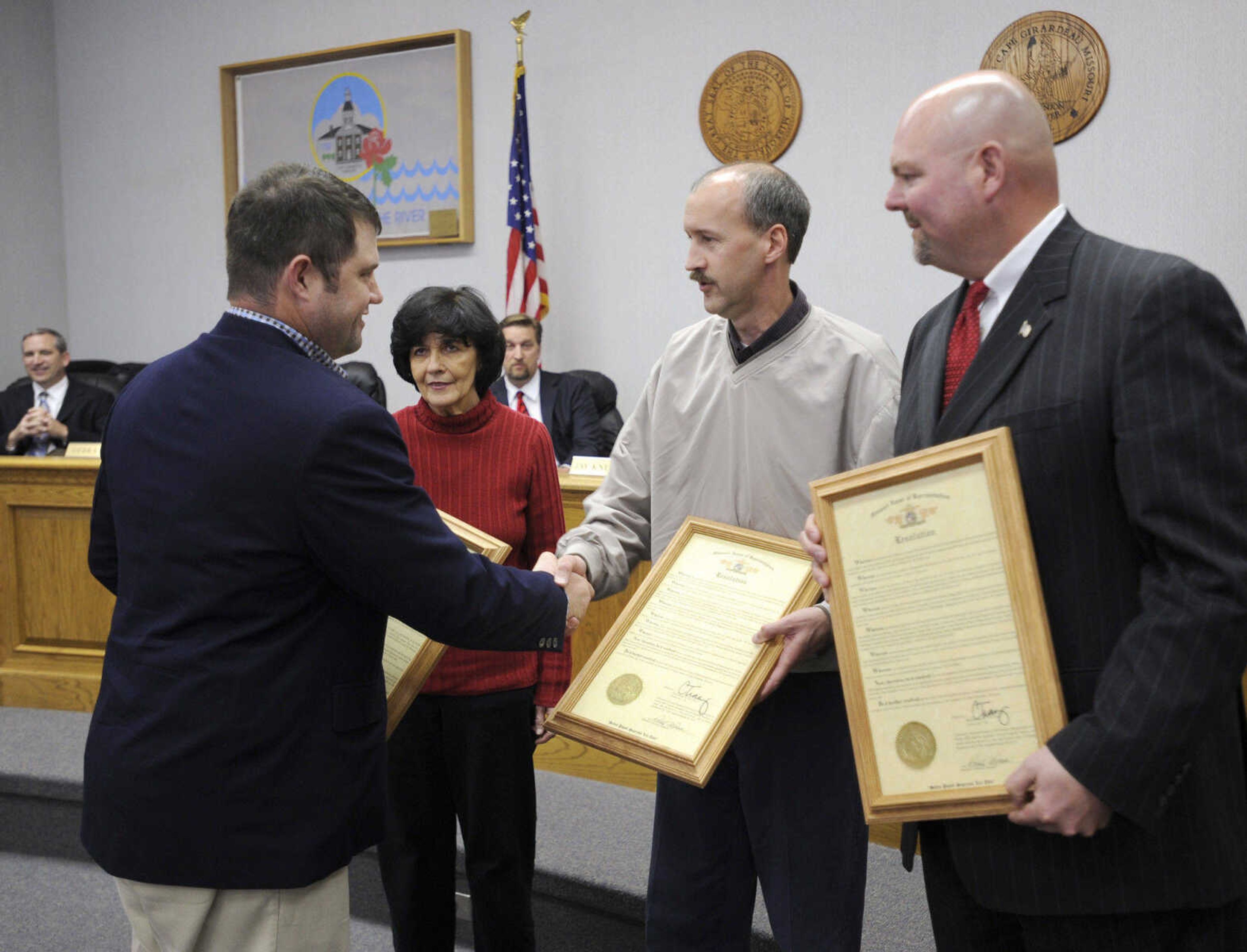 State representative Clint Tracy recognizes the retiring members of the Cape Girardeau city council, from left, Marcia Ritter, Charlie Herbst and Jay Knudtson.