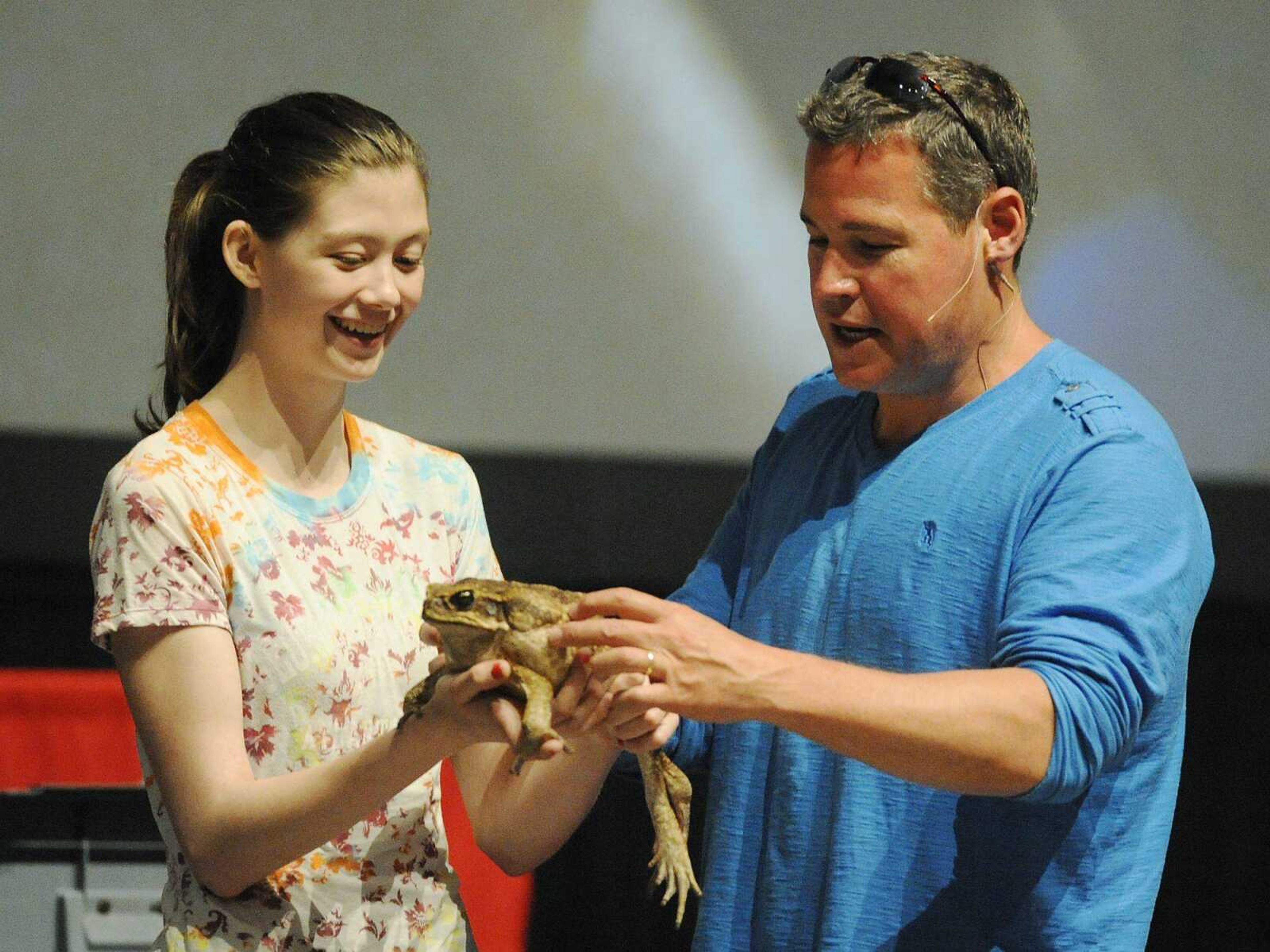 Jeff Corwin, host of ABC&#180;s &#8220;Ocean Mysteries,&#211; talks about the Marine Toad, the largest species of toad in the world, being held by Southeast Missouri State University student Kaitlyn Dodd during his presentation &#8220;Tales from the Field with Jeff Corwin,&#211; as part of SEMO's 2012-2013 Speakers Series Wednesday, April 10, at the Show Me Center. Best known for hosting &#8220;Animal Planet's&#211; immensely popular &#8220;Jeff Corwin Experience,&#211; Corwin has been named Ambassador of Climate Change and Endangered Species on behalf of the Defenders of Wildlife. (ADAM VOGLER)