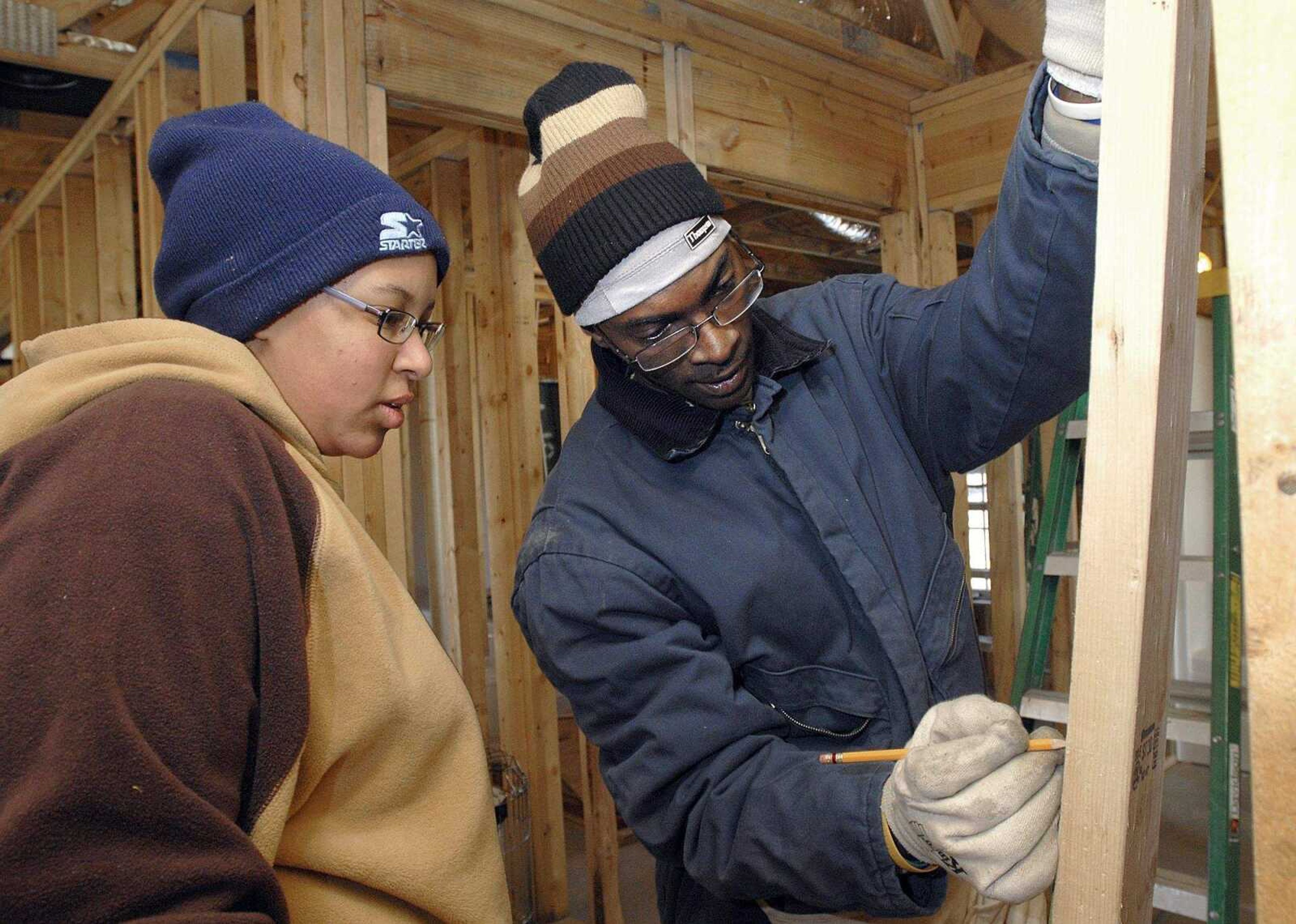 FRED LYNCH ~ flynch@semissourian.com
Tia and Brian Murray contribute "sweat equity" by working with other volunteers to build their own Habitat for Humanity house Saturday in Cape Girardeau.