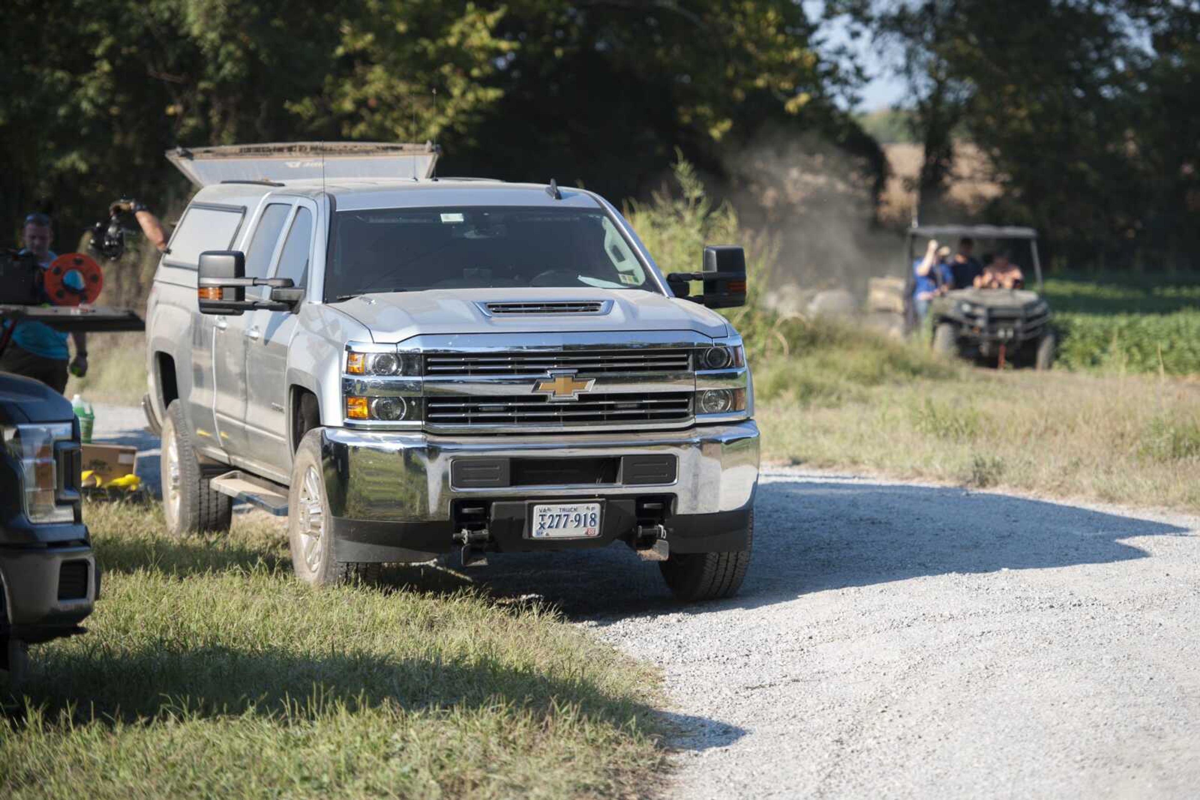 Members of the Scott County Sheriffs Department and FBI agents investigate a property along County Road 329 on Monday near Benton, Missouri.