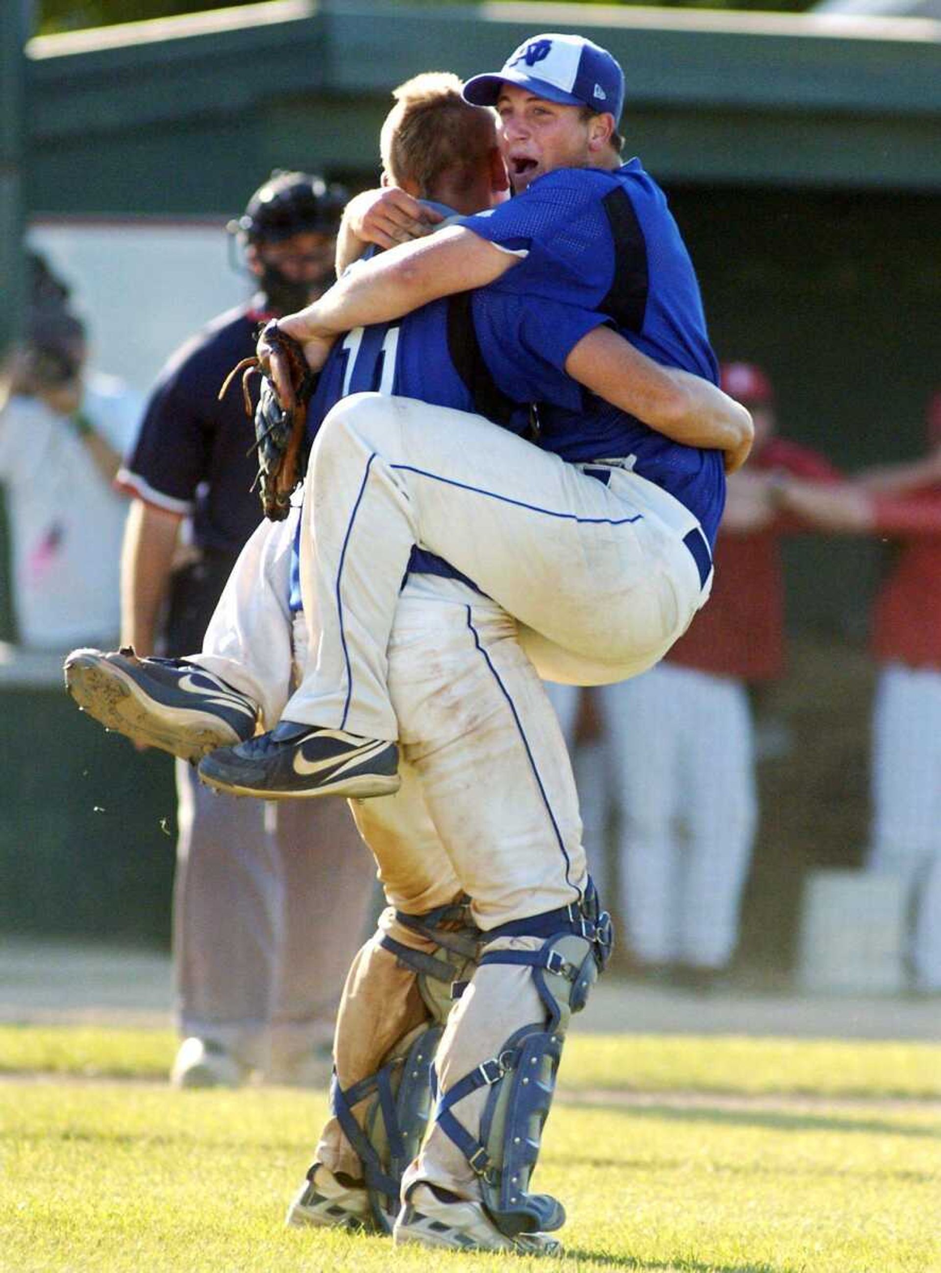 Notre Dame pitcher Dylan Drury jumps into the arms of catcher Mark Hagedorn after winning the Class 3 championship game last month. (JUSTIN KELLEY ~ Special to the Southeast Missourian)