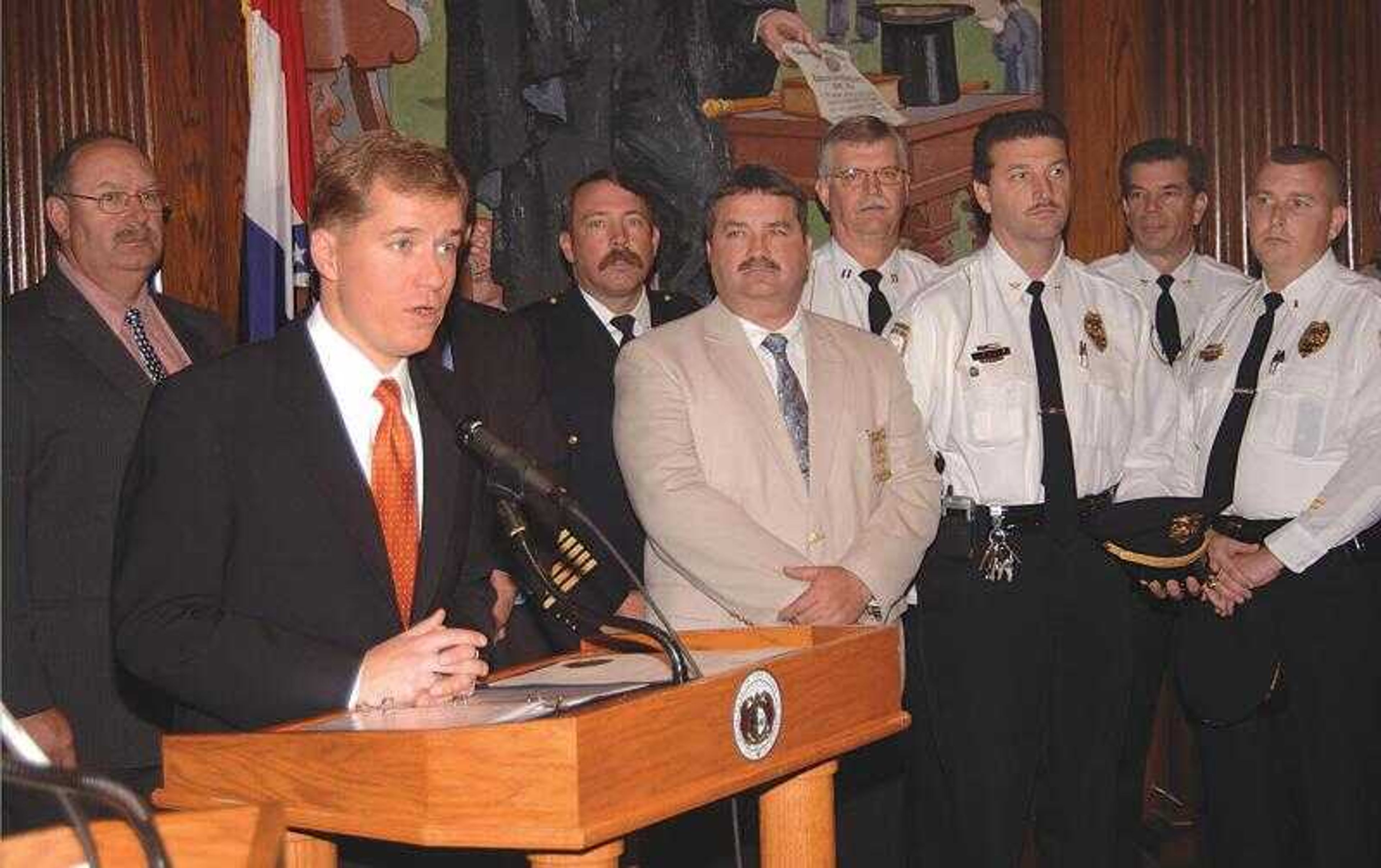 Gov. Matt Blunt honored area law enforcement officials for their role in keeping the peace at the Sept. 17 funeral of a Jackson soldier killed in Iraq. Those present at the proclamation ceremony were, from left, Lt. Vince Diebold, Cape Girardeau County Sheriff Department; Blunt; Drew Juden, director of the Sikeston Department of Public Safety; Cape Girardeau County Sheriff John Jordan; Jackson police Capt. Bob Hall; Jackson police chief James Humphreys; Cape Girardeau police chief Carl Kinnison; and Jackson police Lt. Chris Mouser. (Submitted photo)