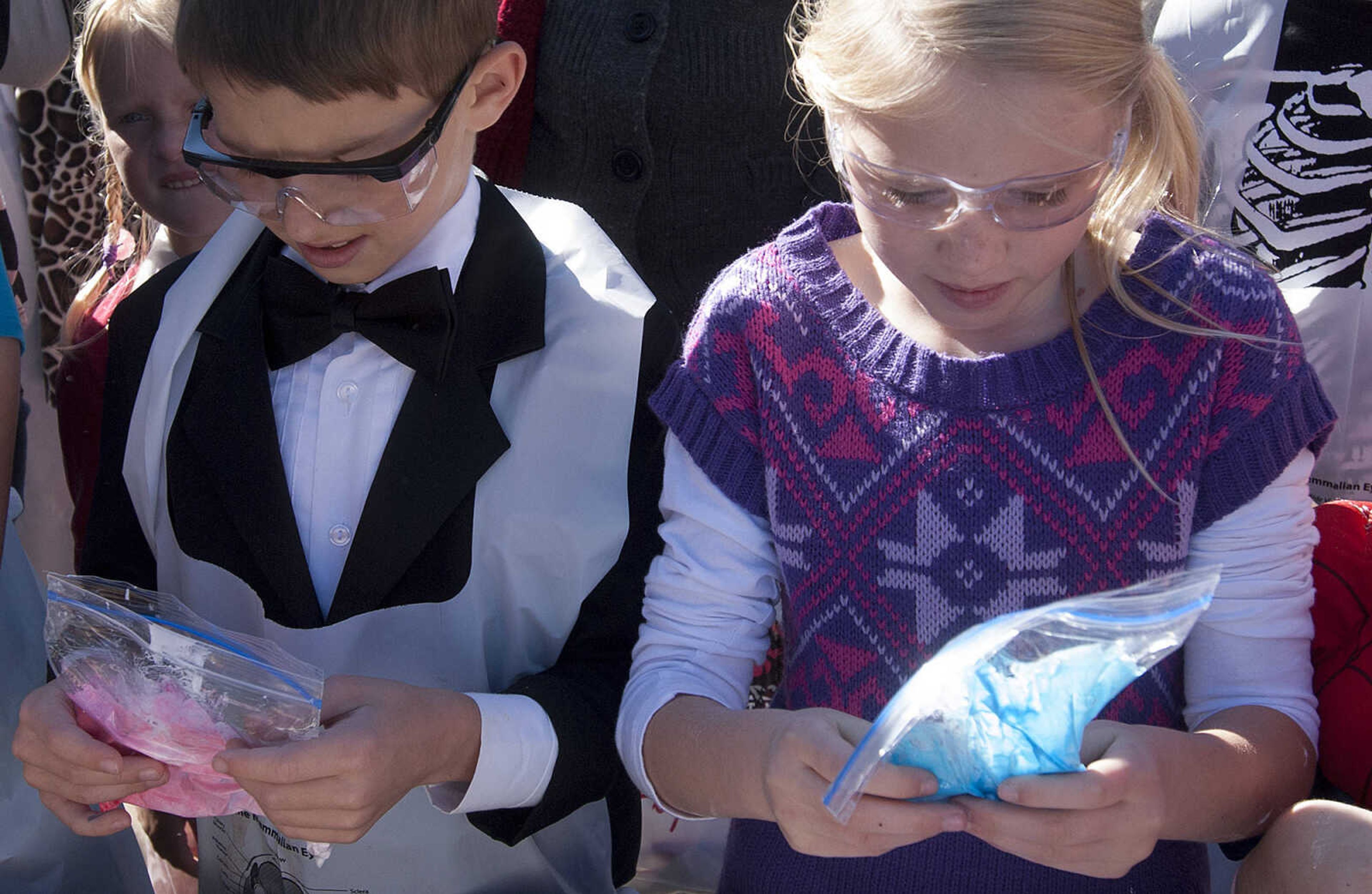 Children learn how to make slime out of glue and borax with a little food coloring and glitter during the fifth annual Halloween Science Night Sunday, Oct. 20, on the campus of Southeast Missouri State University. The event featured 21 stations, such as the "Scream Room," "Creepy Creatures," or the "Mucus Lab," each with a different Halloween themed science activity. The night is funded by a grant from the Missouri Foundation for Health in partnership with Southeast's College of Science, Technology and Agriculture and Extended and Continuing Education.