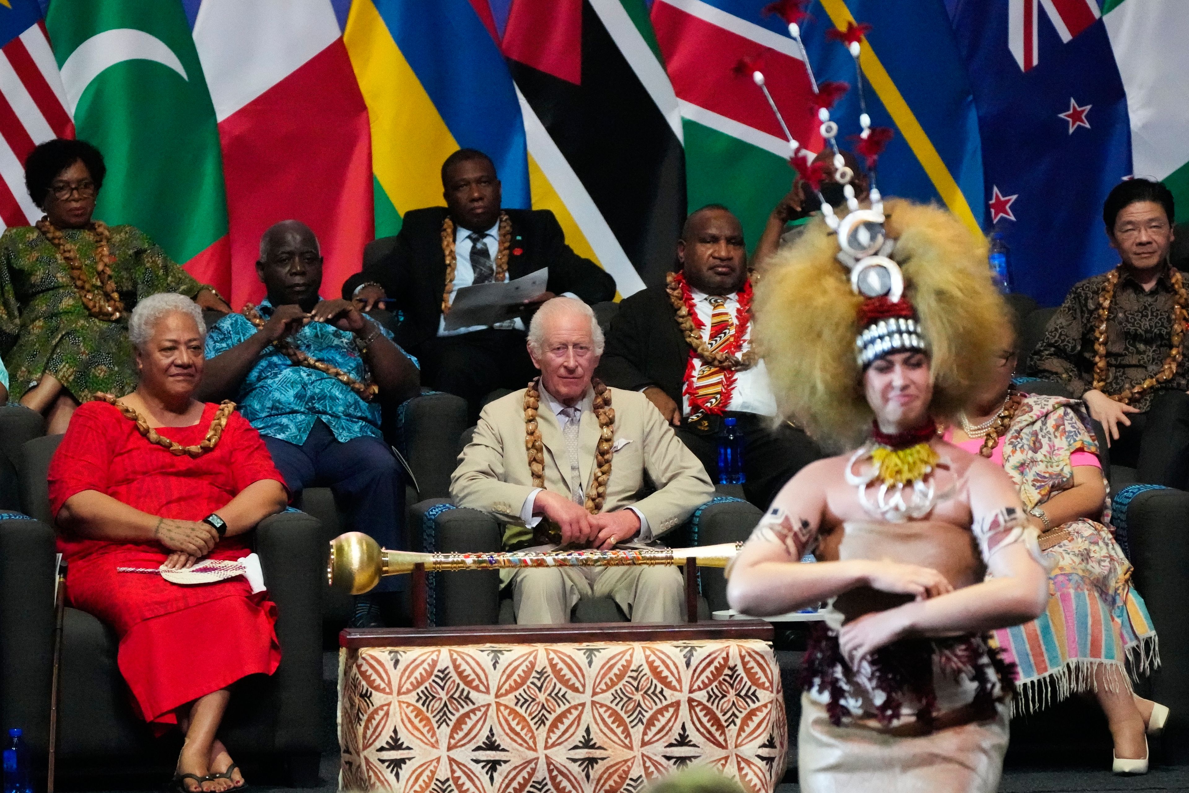 Britain's King Charles and Samoan Prime Minister Afioga Fiamē Naomi Mataʻafa, left, watch dancers perform during the opening ceremony for the Commonwealth Heads of Government meeting in Apia, Samoa, Friday, Oct. 25, 2024. (AP Photo/Rick Rycroft/Pool)