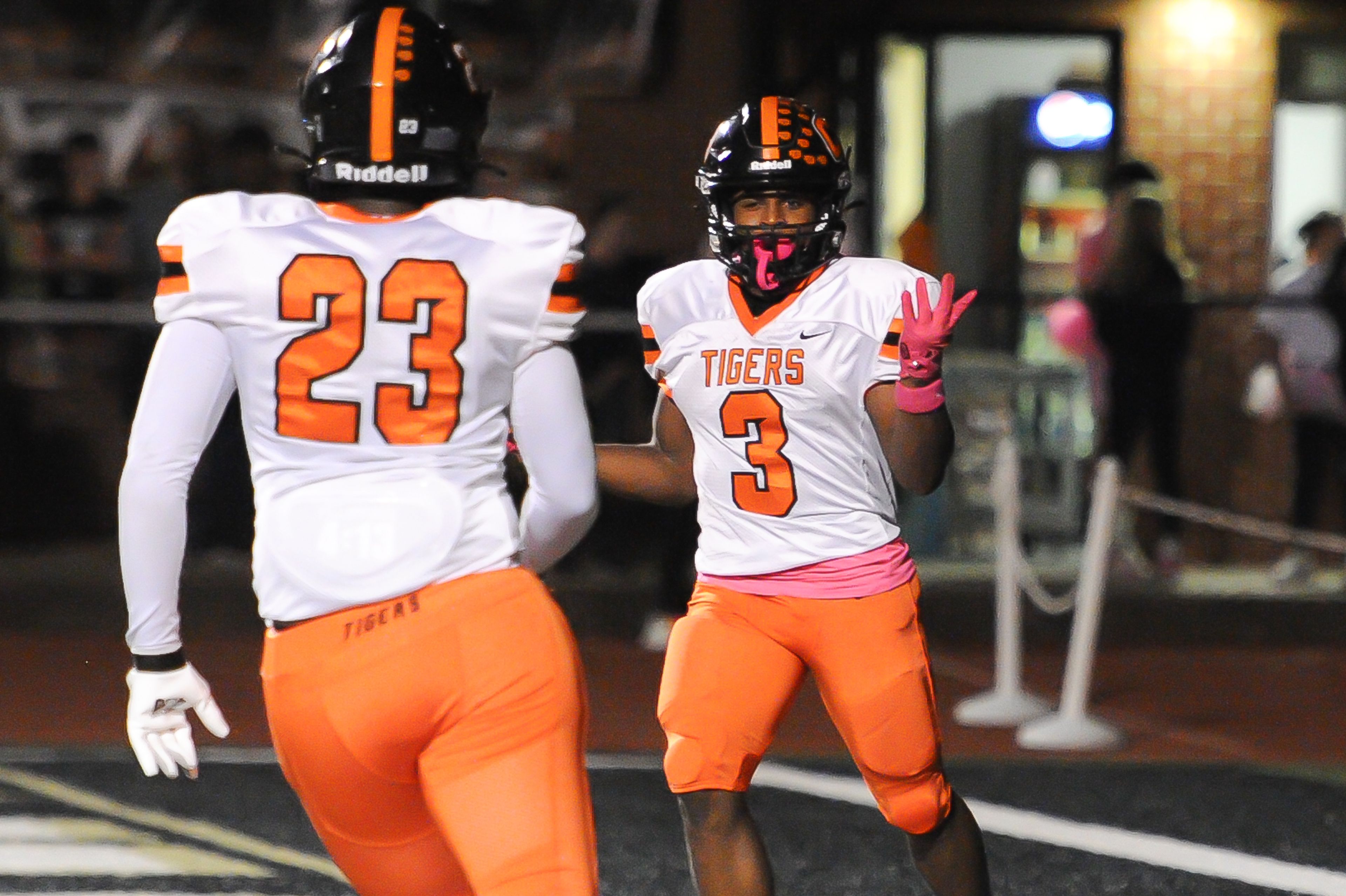 Cape's Zai'Aire Thomas, right, shrugs after a touchdown during a game between the Farmington Knights and the Cape Central Tigers on Friday, Oct. 11, at Farmington High School in Farmington. 