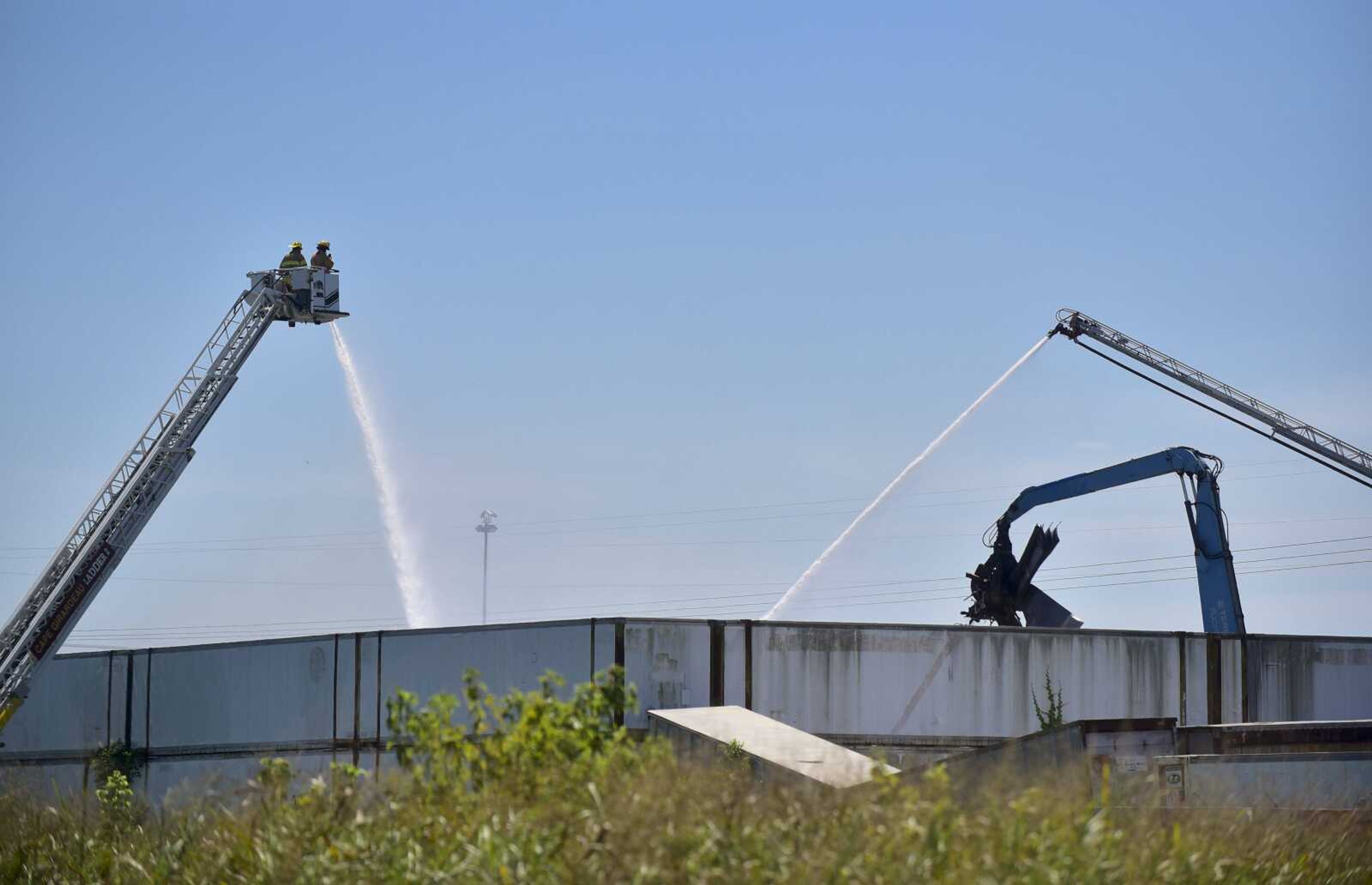 The Cape Girardeau Fire Department hoses down a fire Thursday at Cape Metal Recycling. Several stations were called out to the scene at 12:06 p.m. for a fire in the yard.