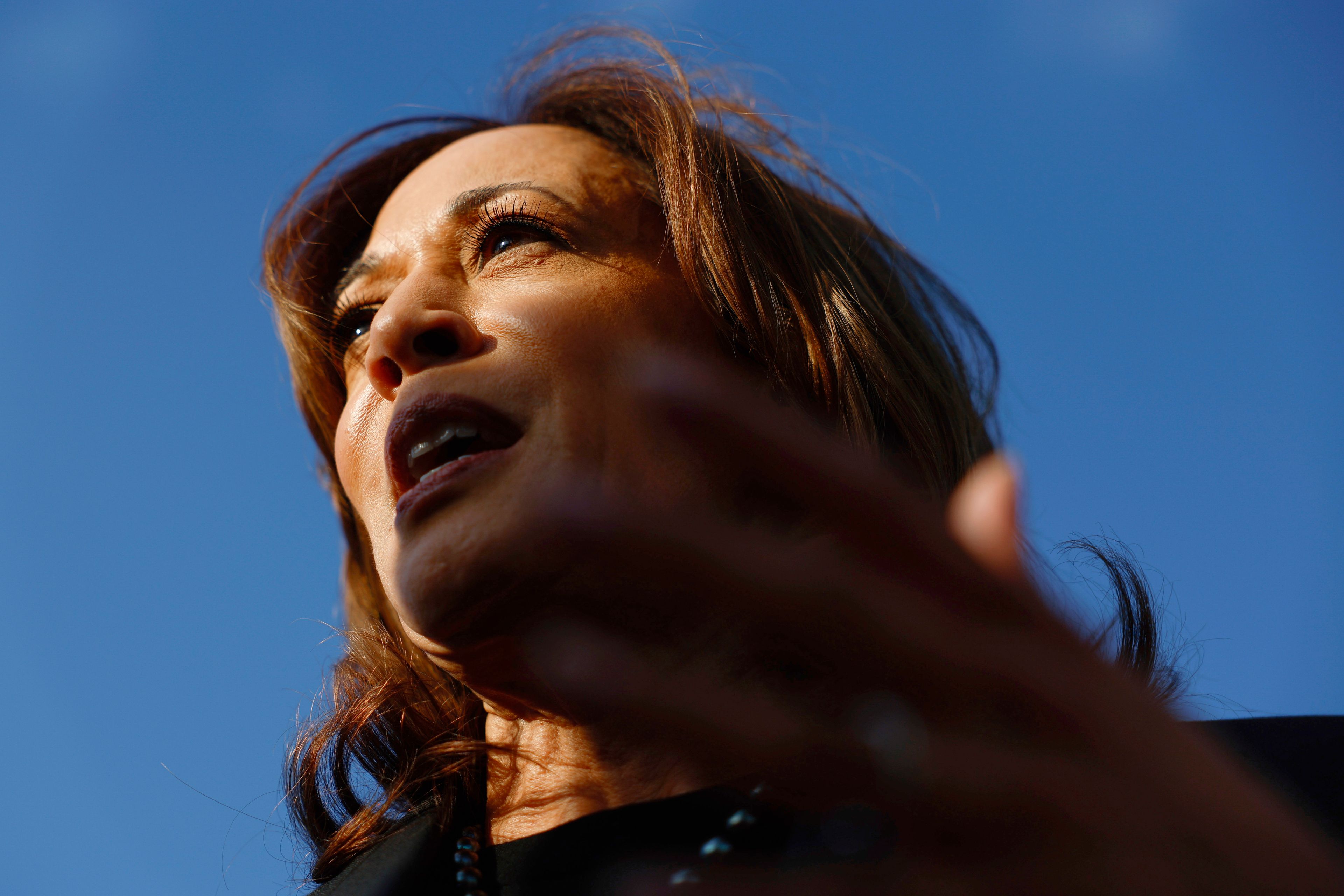 Democratic presidential nominee Vice President Kamala Harris speaks to reporters before boarding Air Force Two to depart for New York at Joint Base Andrews, Md., Monday, Oct. 7, 2024. (Evelyn Hockstein/Pool via AP)