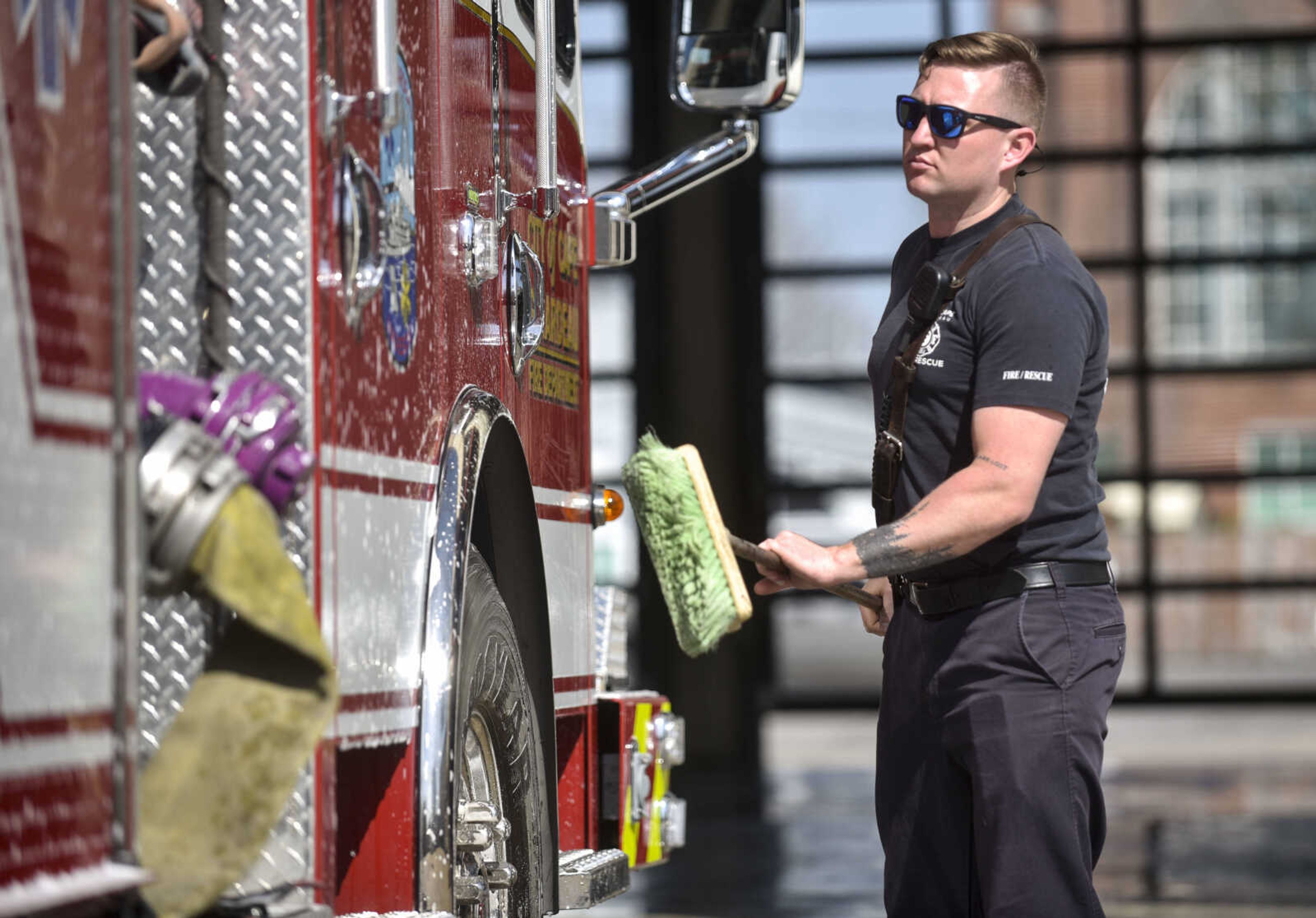 Cape Girardeau firefighter David Uptmor washes Engine 1 on Tuesday, April 17, 2018, at Cape Girardeau Fire Station No. 1 in Cape Girardeau.